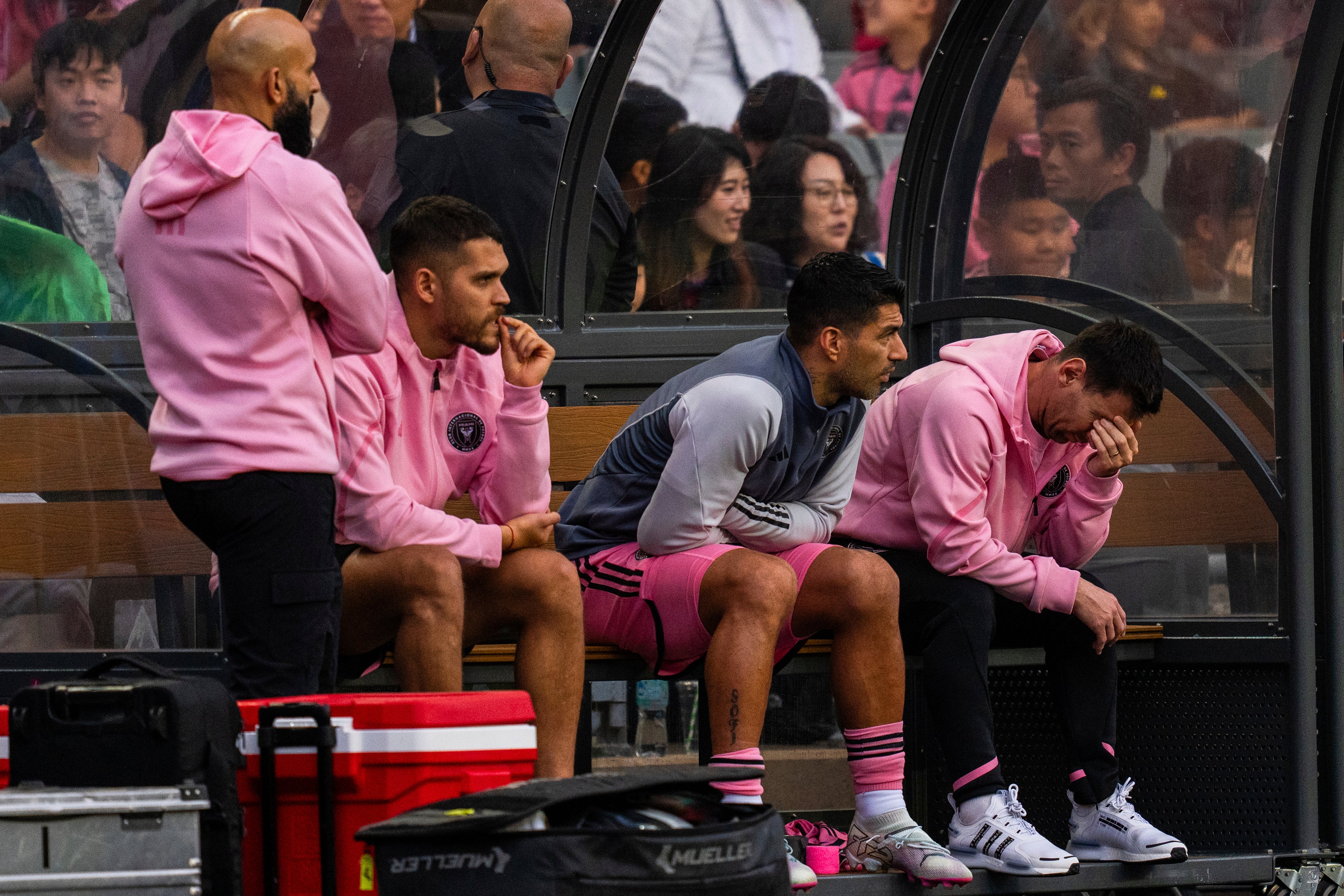 Inter Miami’s Lionel Messi, right, reacts from the bench during the friendly football match in Hong Kong