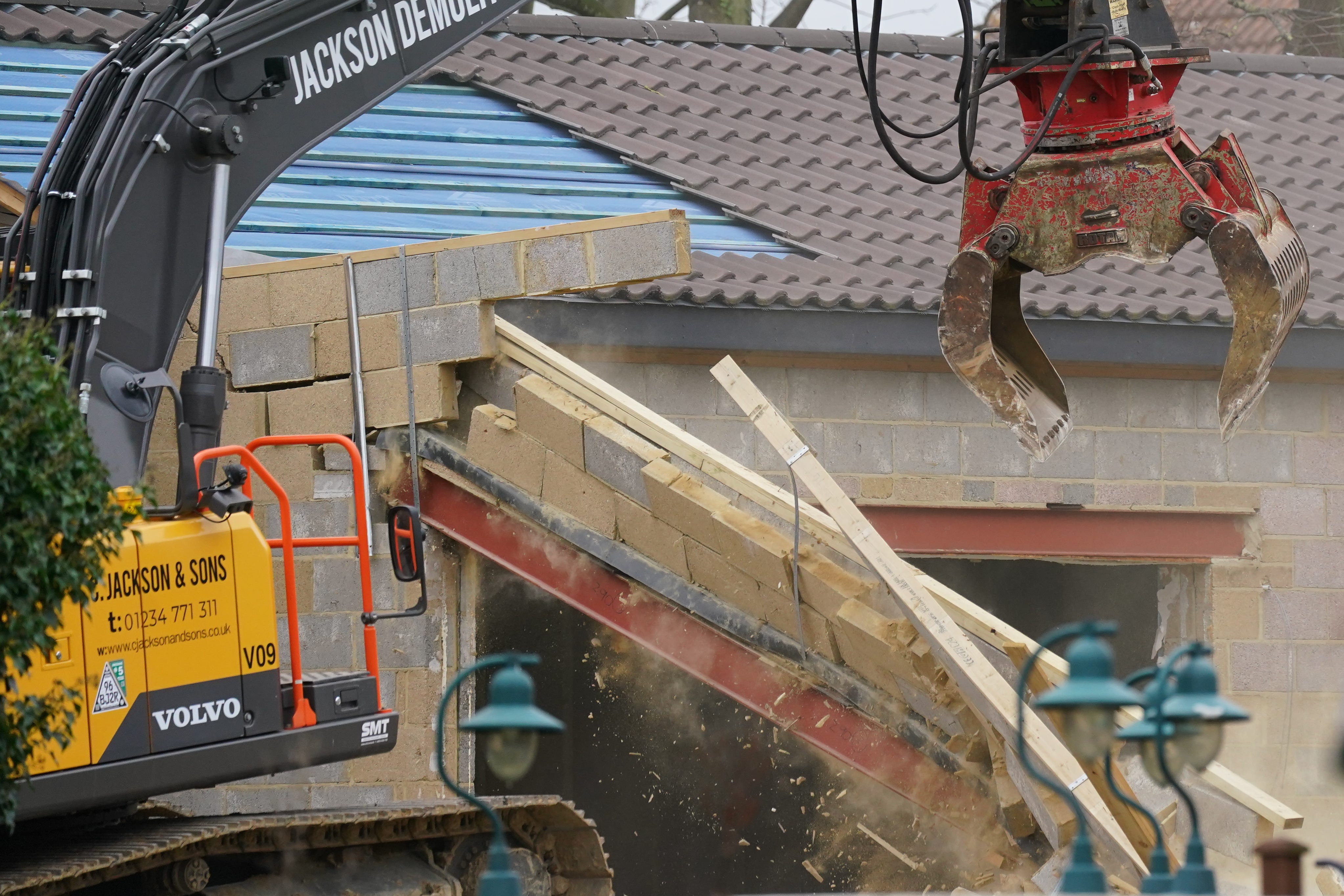 Significant demolition work continued at the property on Monday (Jacob King/PA)