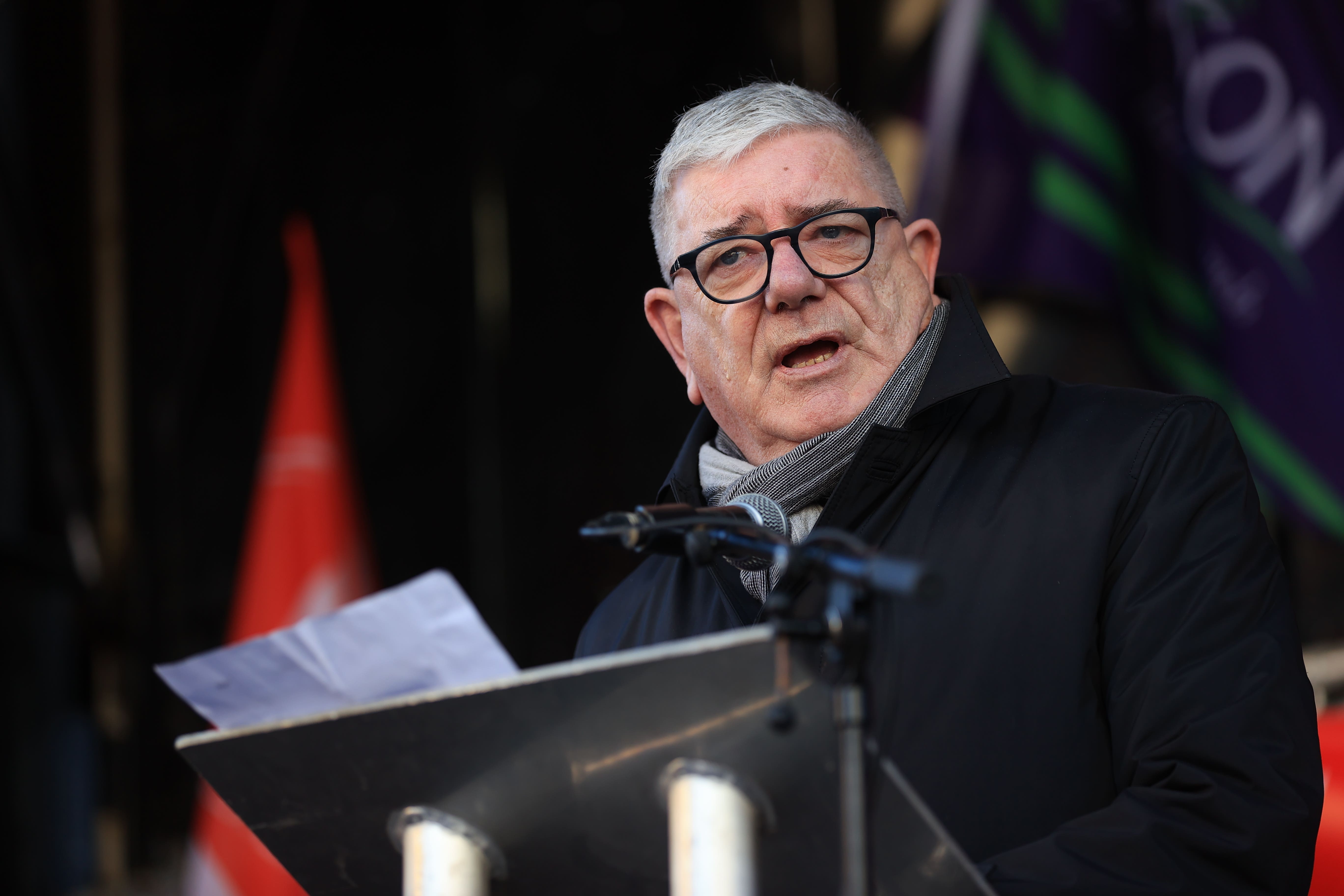 Gerry Murphy, Assistant General Secretary of the Irish Congress of Trade Unions, addresses union members outside Belfast City Hall, Belfast, as an estimated 150,000 workers take part in walkouts over pay across Northern Ireland. The strike is set to have a major impact with schools closed, hospitals offering only Christmas Day-level services, public transport cancelled as well as limited gritting of the roads in zero-degree temperatures. Picture date: Thursday January 18, 2024.