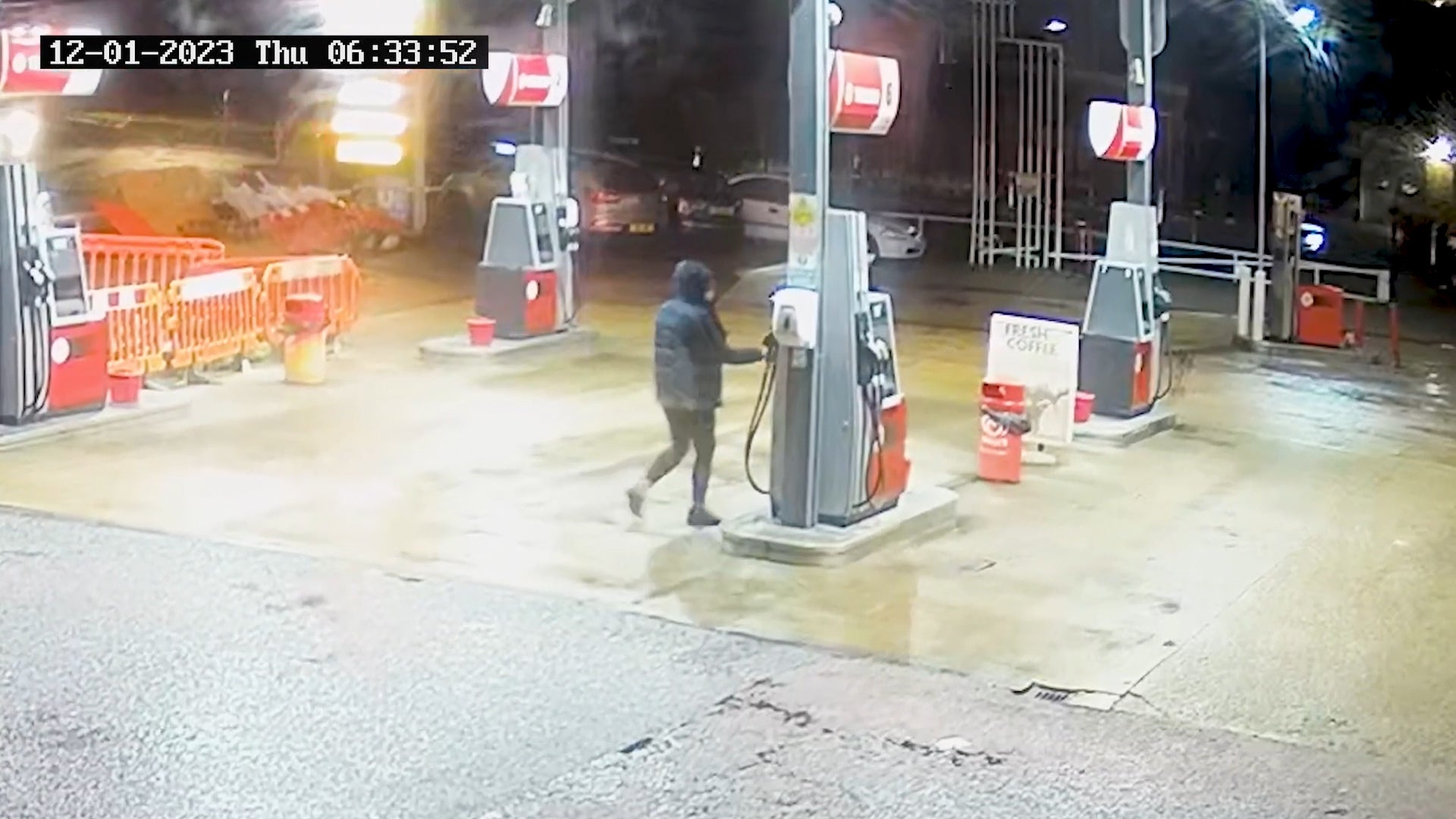 CCTV footage of Marten filling a bottle with petrol at Texaco in Newhaven