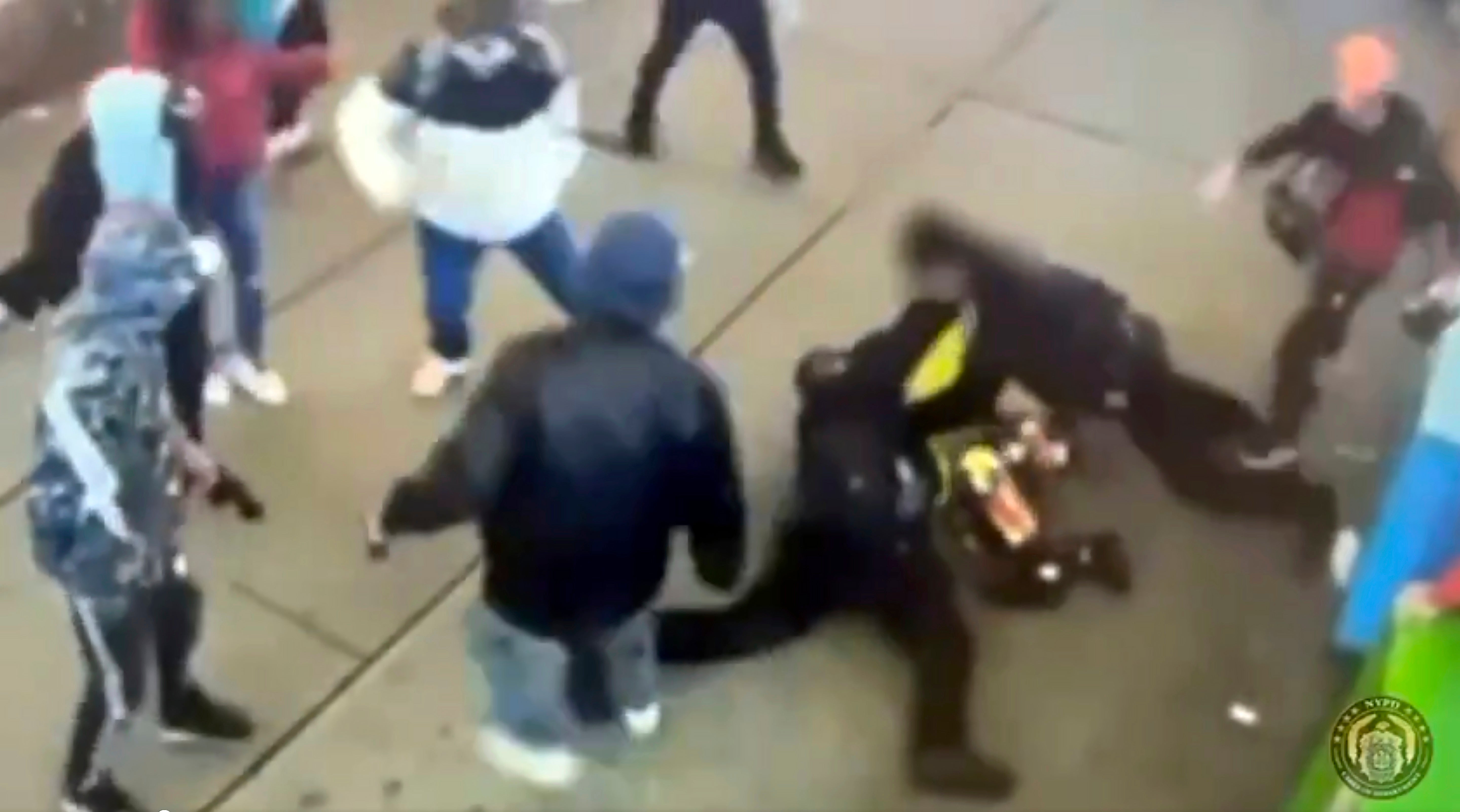 This image taken from video provided by the New York City Police Department shows police officers confronting a group