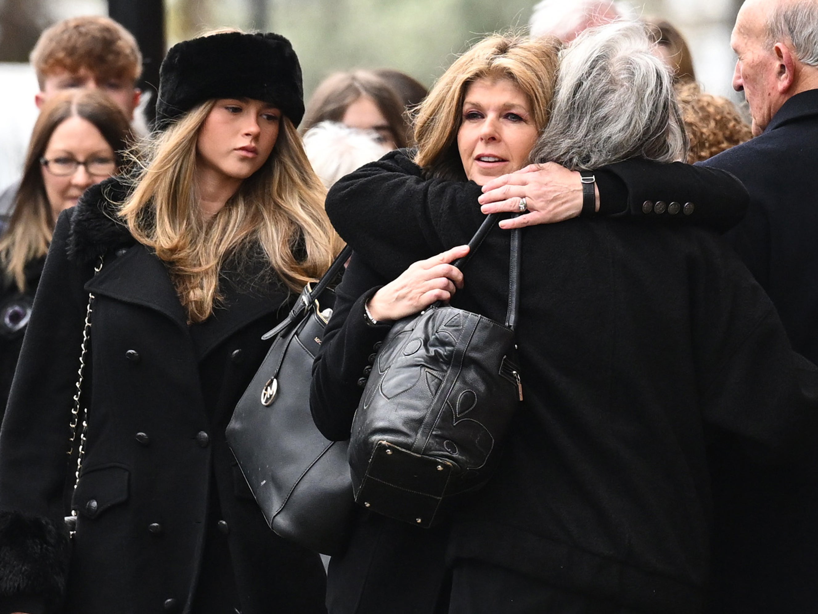 Garraway and her daughter greet family members outside the service in London