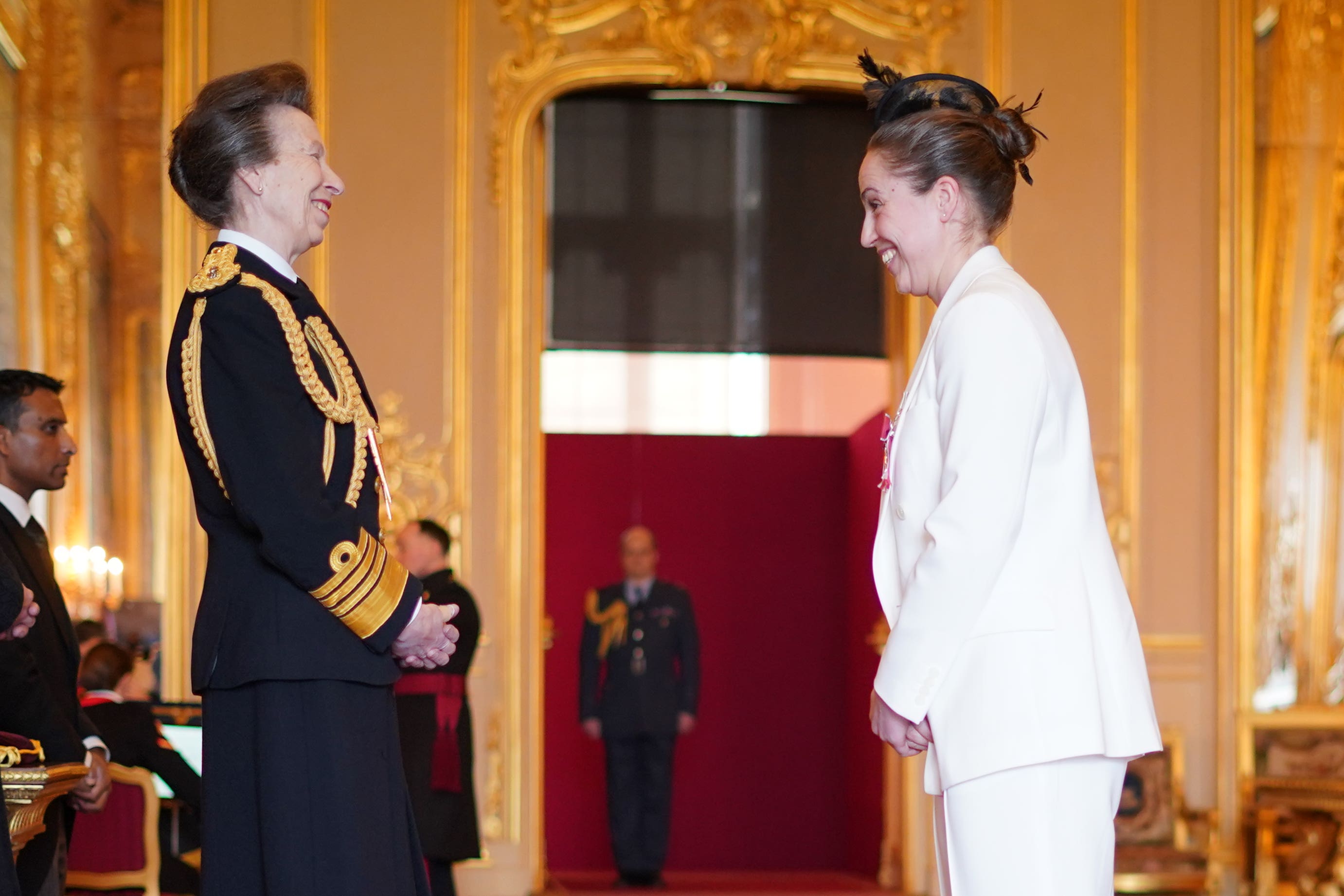 Anne spoke warmly with recipients of honours at Windsor Castle, including Sara Cox (Yui Mok/PA)