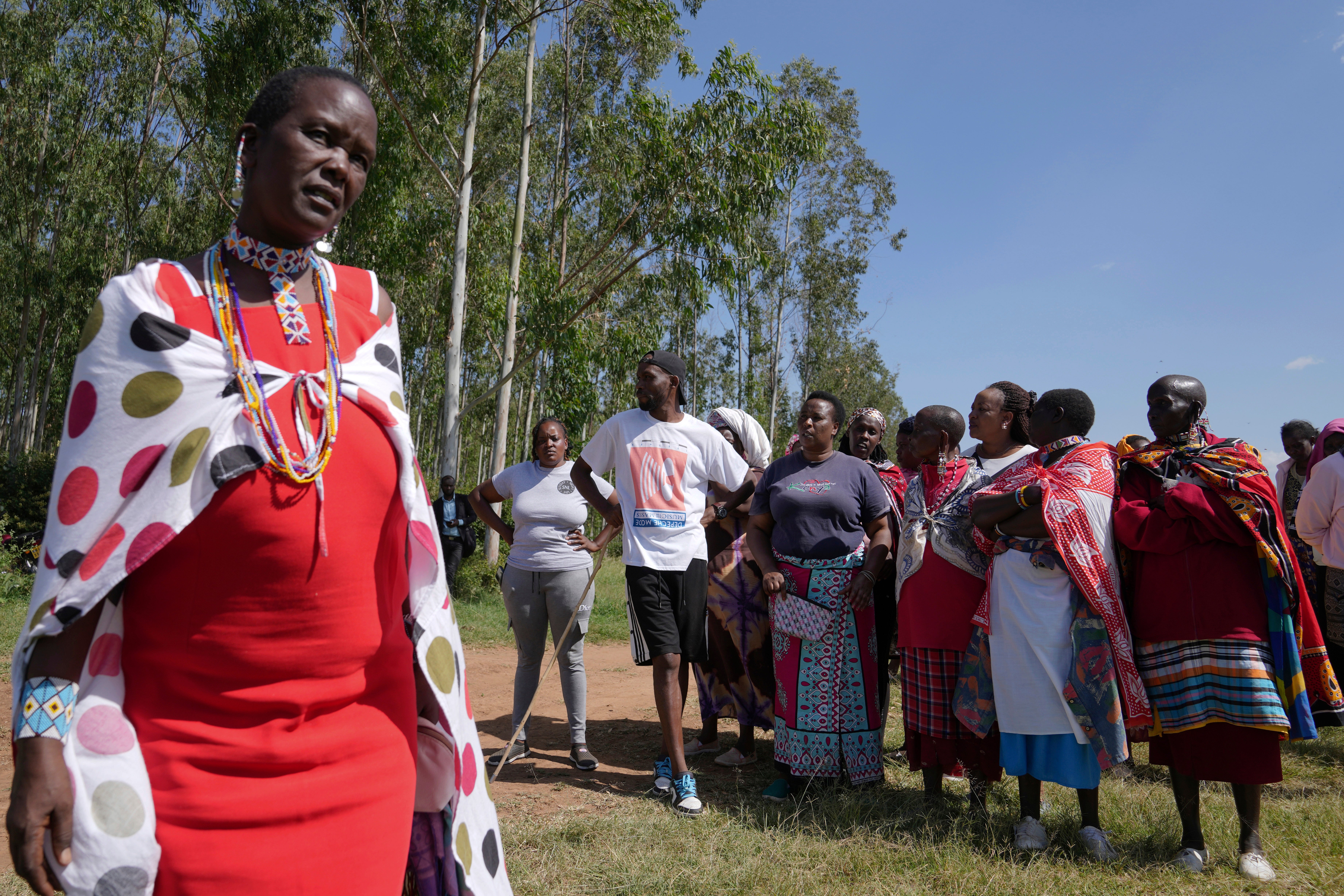 Family and friends gather to mourn Anthony Shungea Pasha who was killed by hyenas while he was collecting firewood at a forest neighbouring his homestead, in Kajiado, Kenya Tuesday