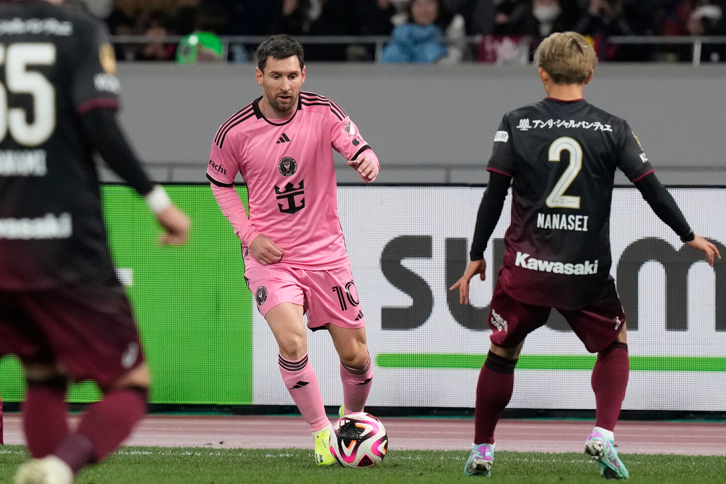 Lionel Messi (centre) has been managing a hamstring problem and came off the bench for the closing stages (Eugene Hoshiko/AP)