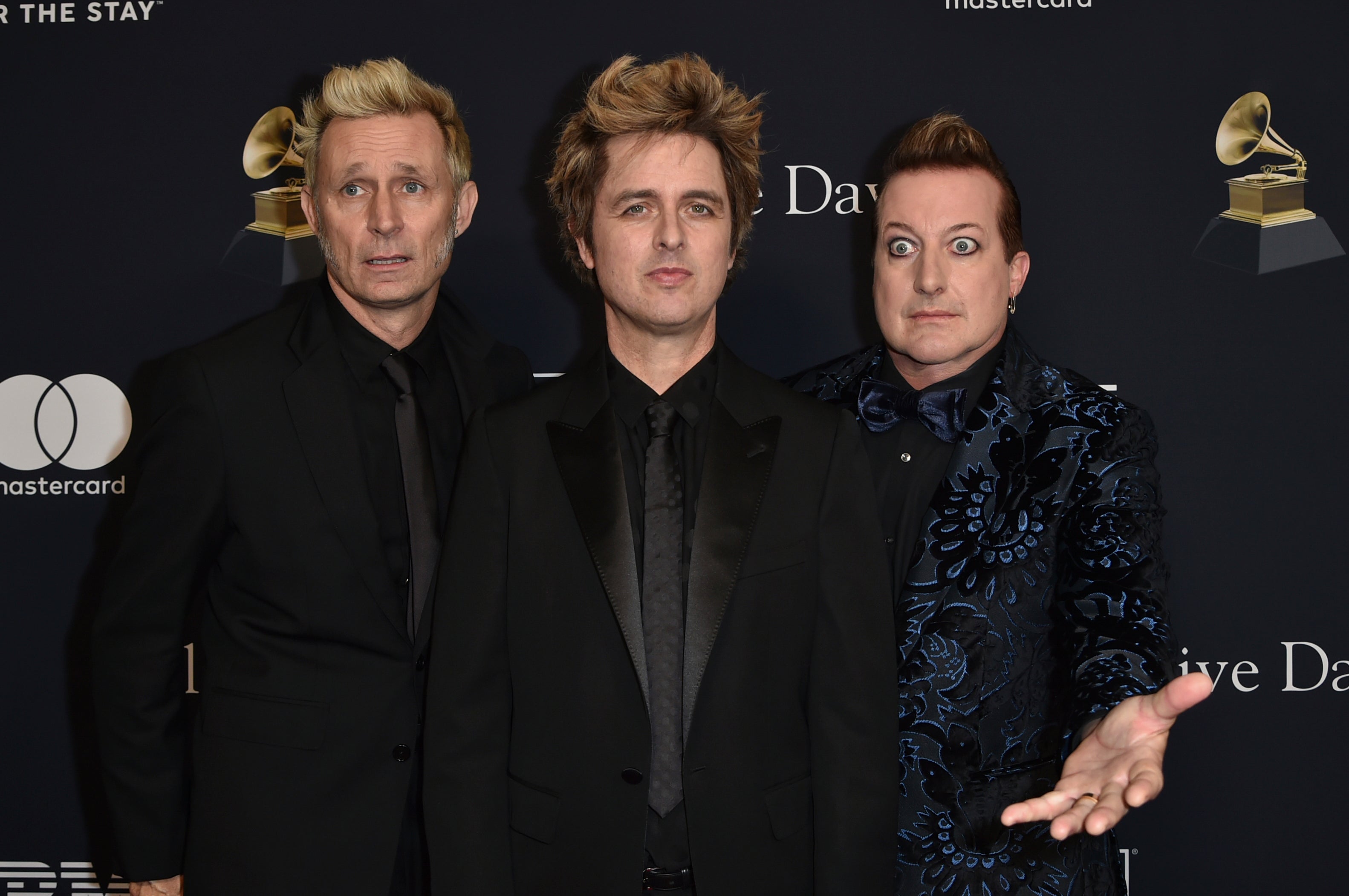 Green Day members Mike Dirnt, from left, Billie Joe Armstrong, and Tre Cool at the 2024 Grammy Awards