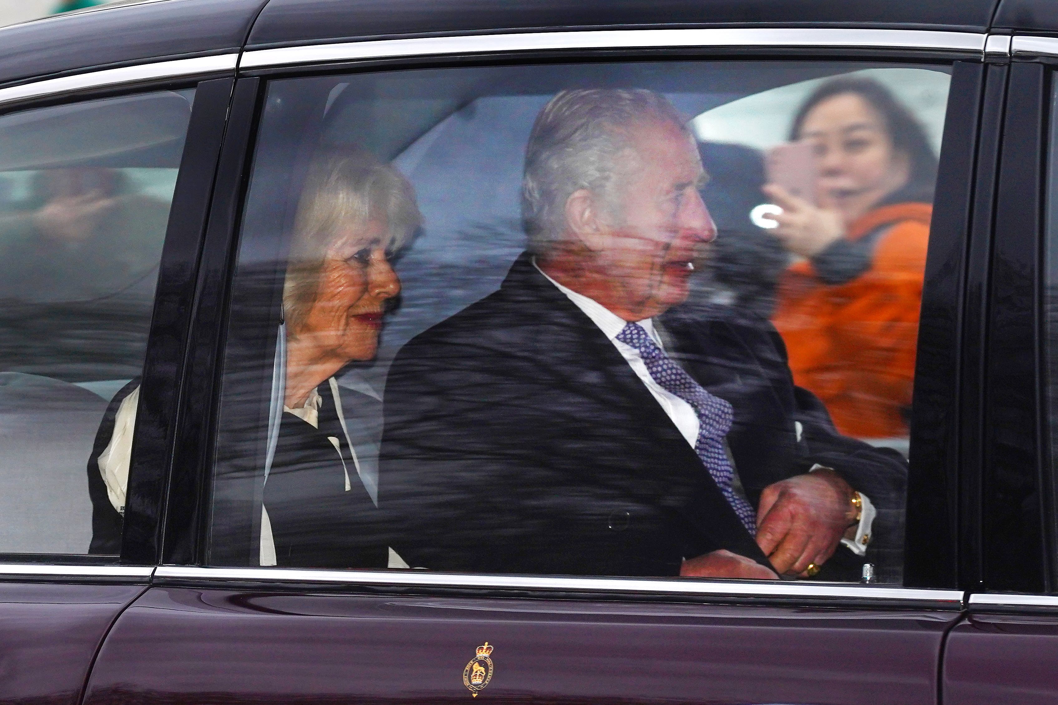 The King and Queen on The Mall after leaving Clarence House (PA)