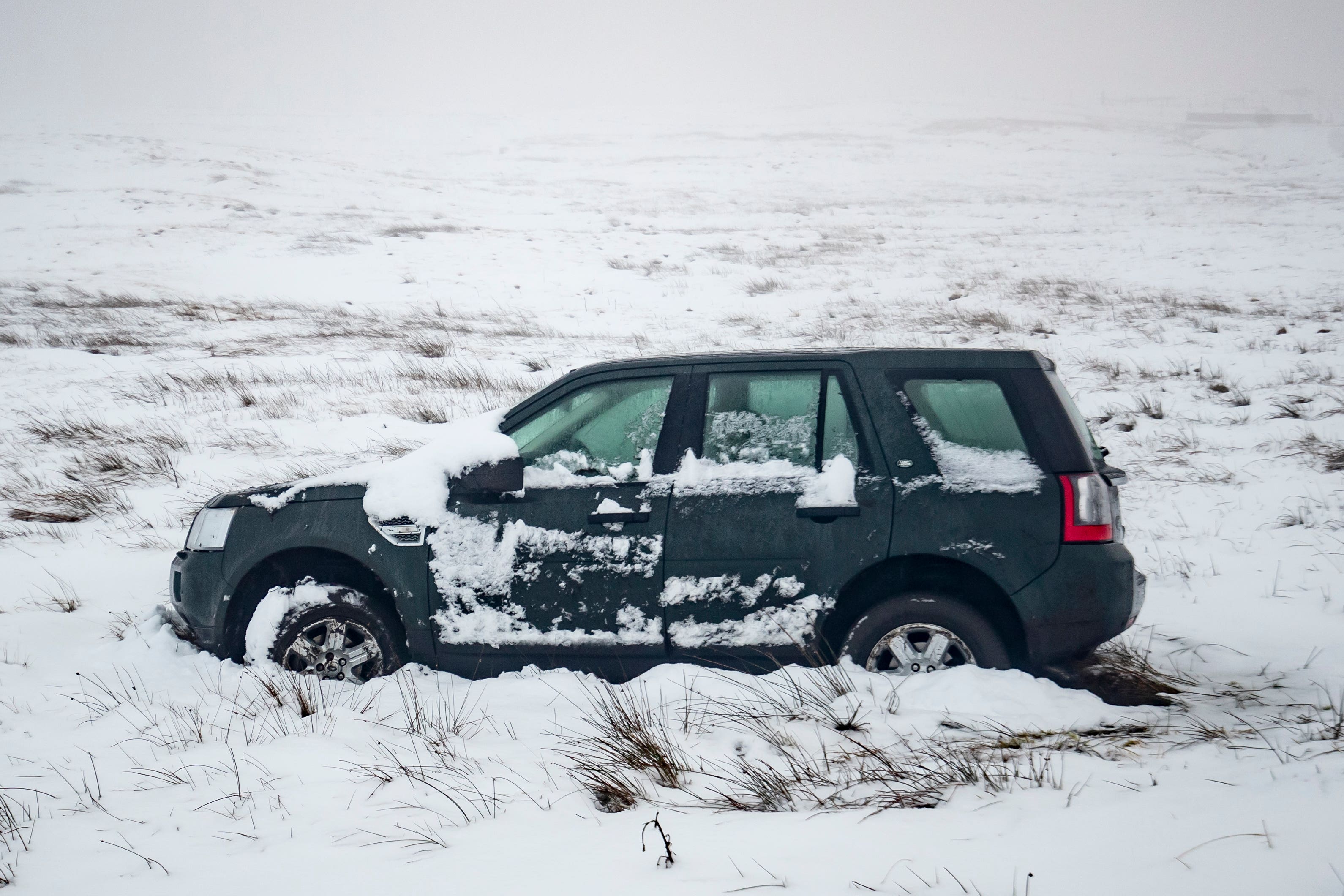 Nearly two out of five (39%) motorists would still get behind the wheel regardless of the amount of snow on the roads, a new survey suggests (Danny Lawson/PA)