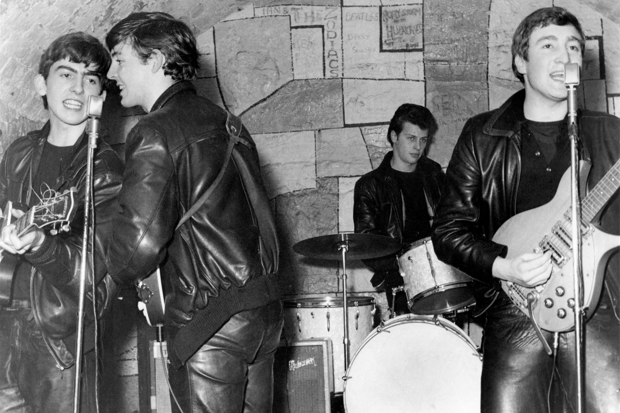 The Beatles performing at the Cavern Club in 1961