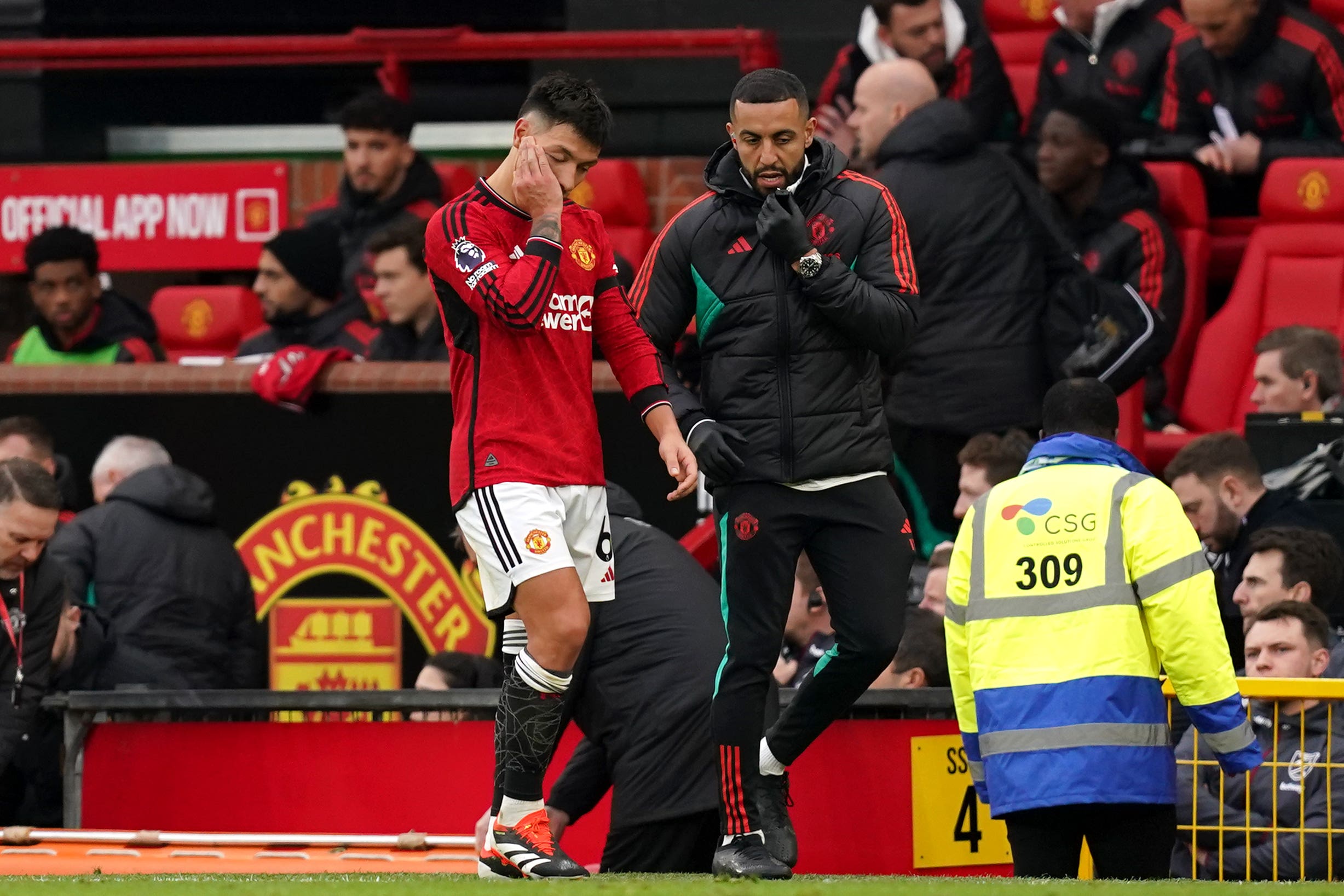 Lisandro Martinez limps out of the game against West Ham (Martin Rickett/PA)