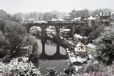 Schools shut as snow falls across parts of the UK – and warnings continue