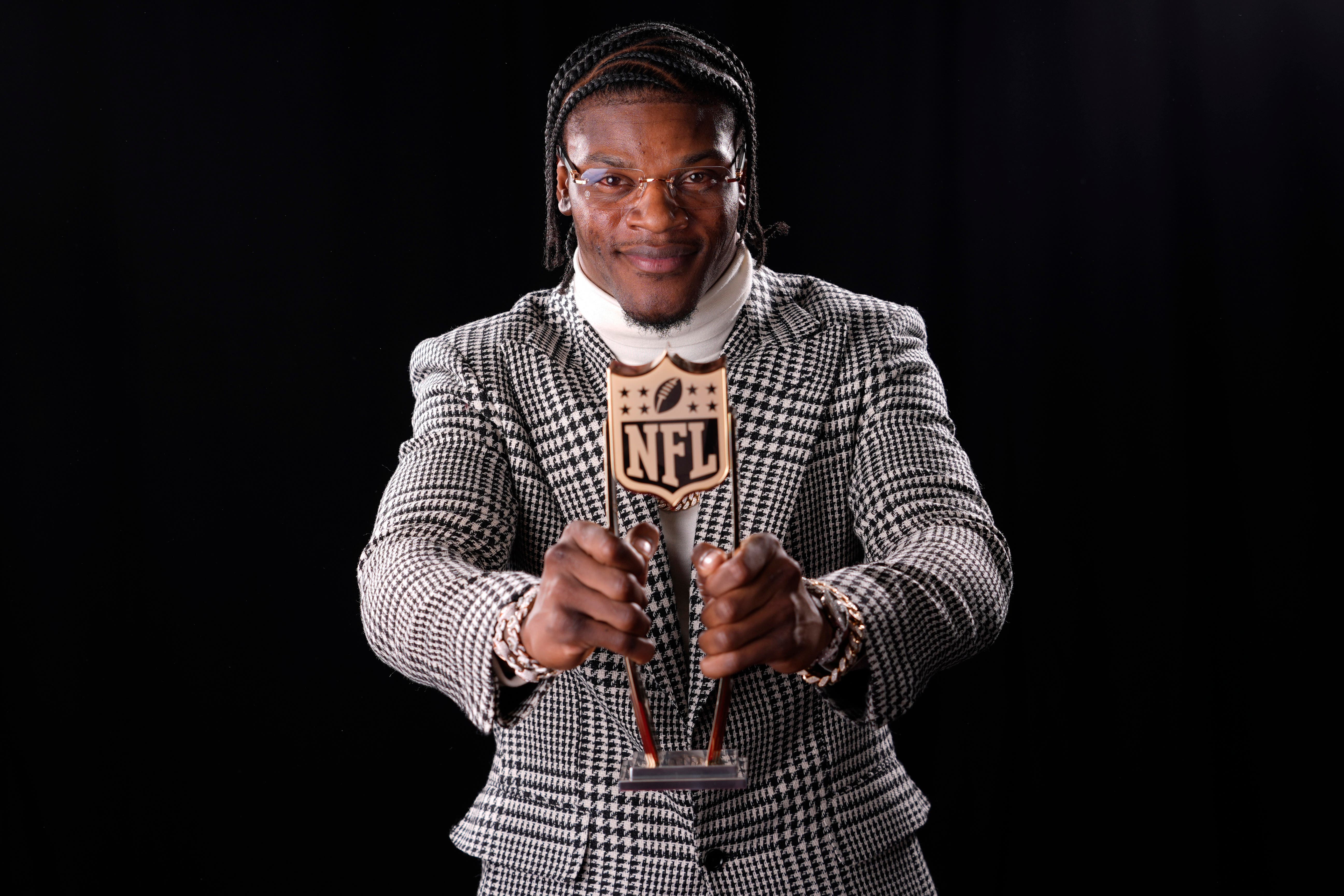 Baltimore Ravens’ Lamar Jackson poses after winning the award (Matt York/AP)