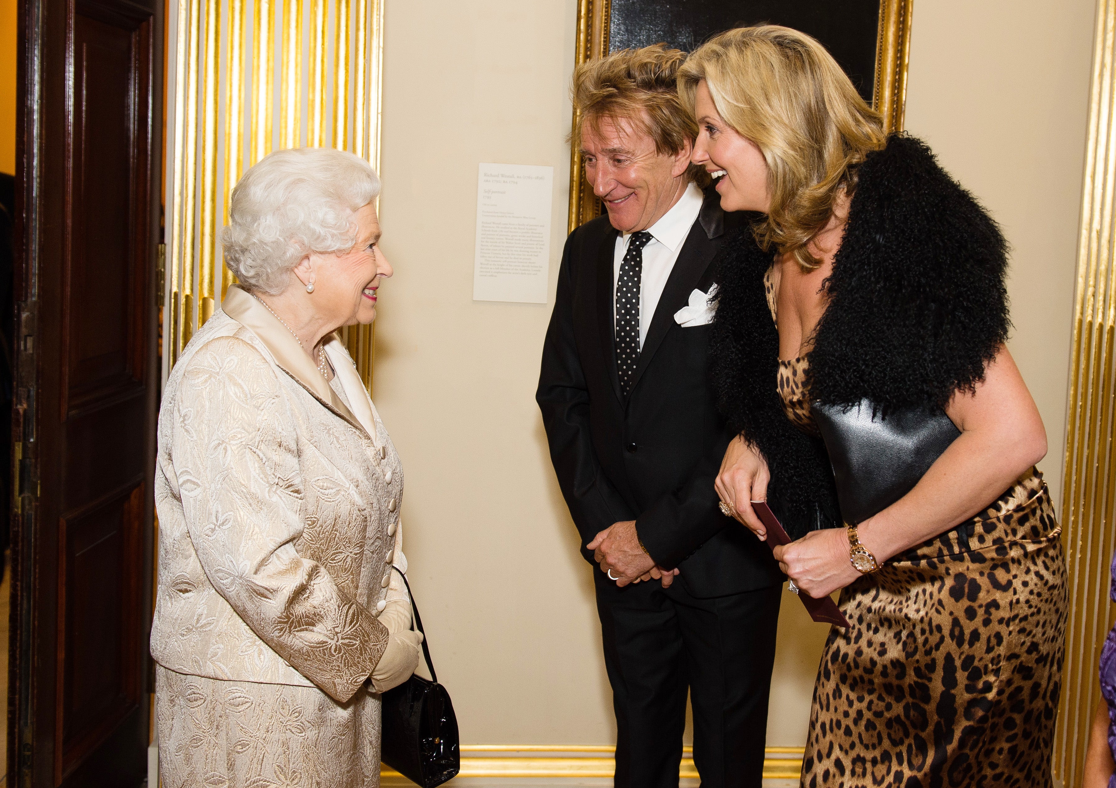 Rod Stewart and his wife Penny Lancaster with the late Queen Elizabeth II, after he received his knighthood for services to music and charity