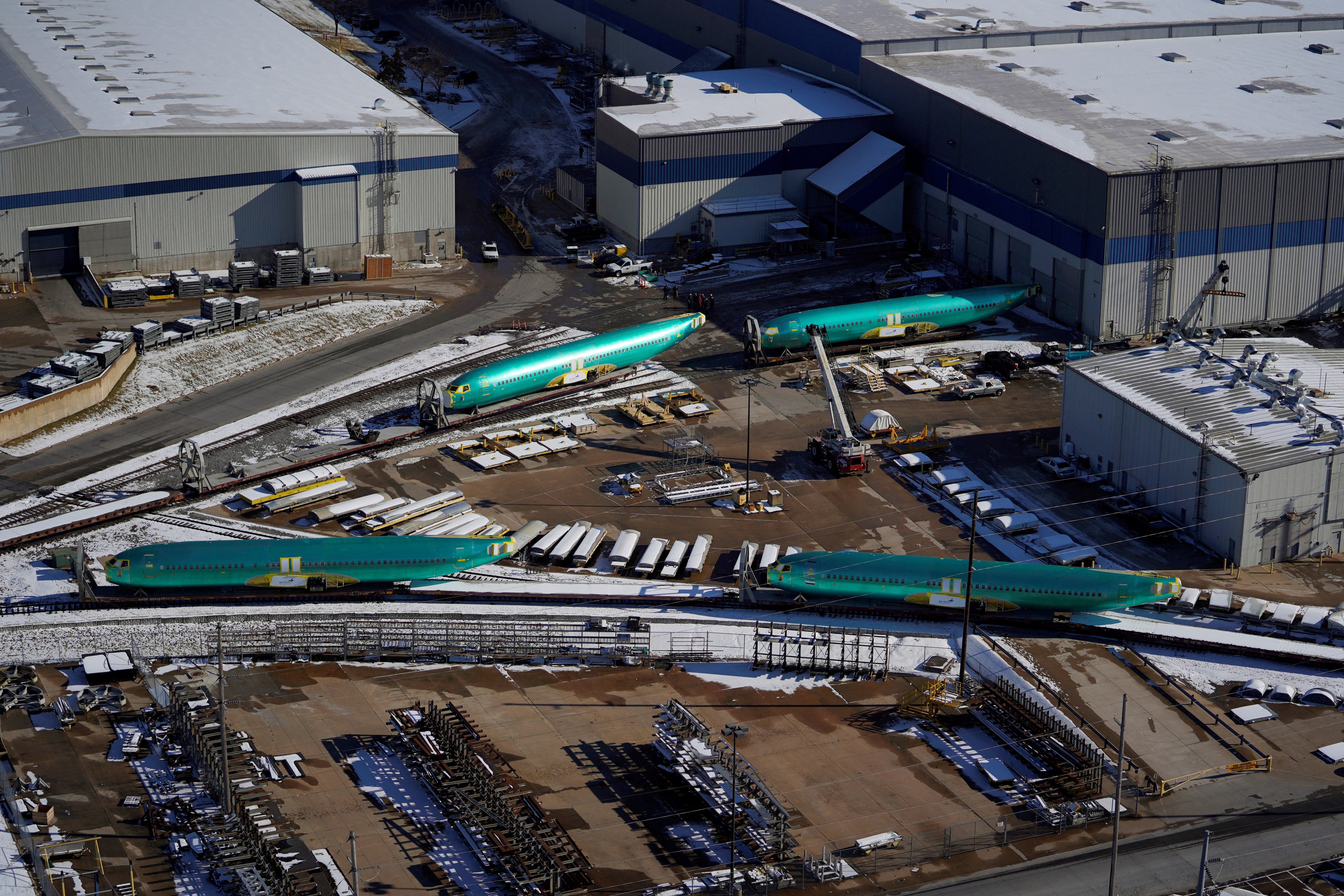 Airplane fuselages bound for Boeing's 737 Max production facility are pictured in 2019 awaiting shipment on rail sidings at Spirit AeroSystems in Wichita