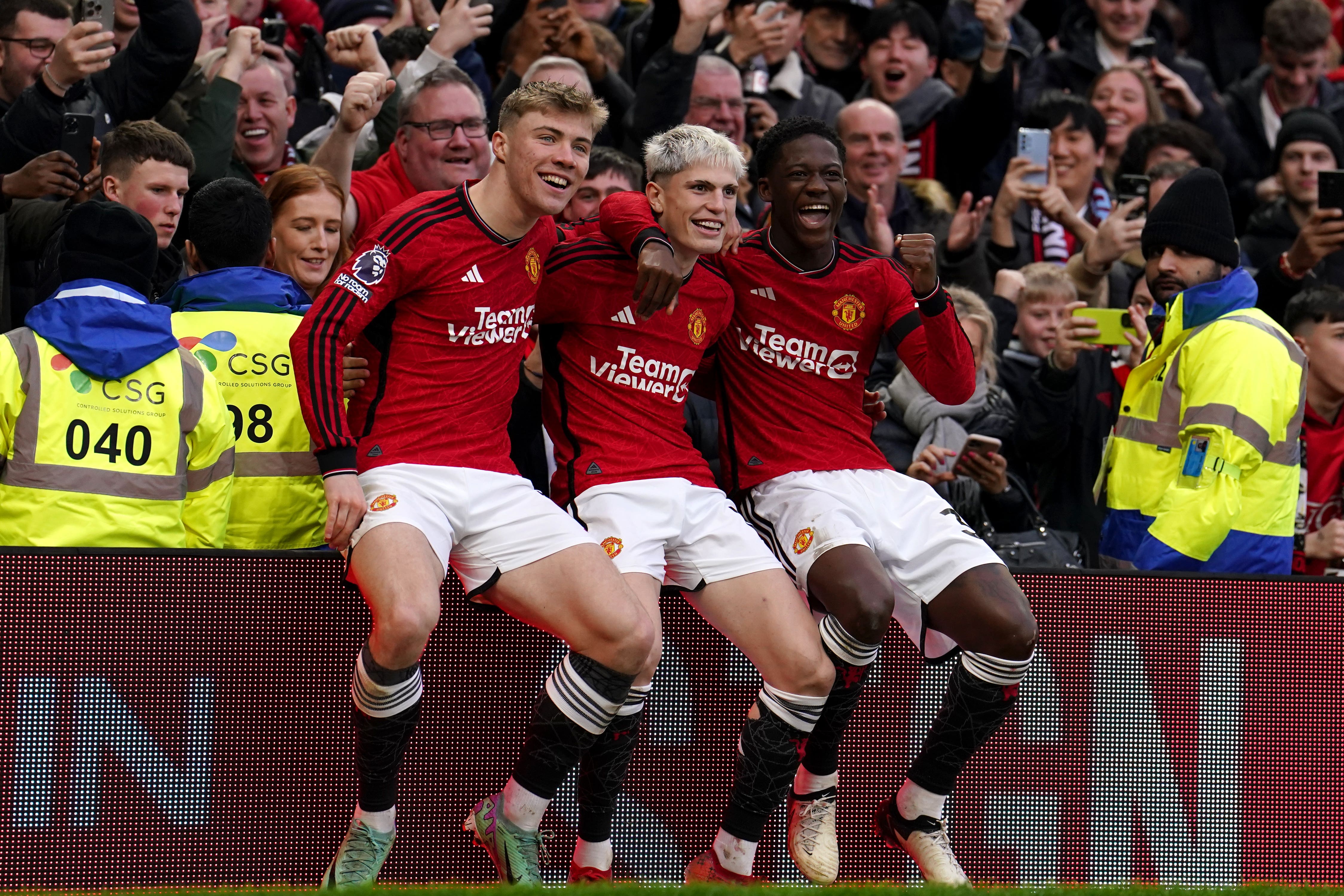 Alejandro Garnacho, centre, celebrates with Rasmus Hojlund, left, and Kobbie Mainoo after scoring against West Ham (Martin Rickett/PA)