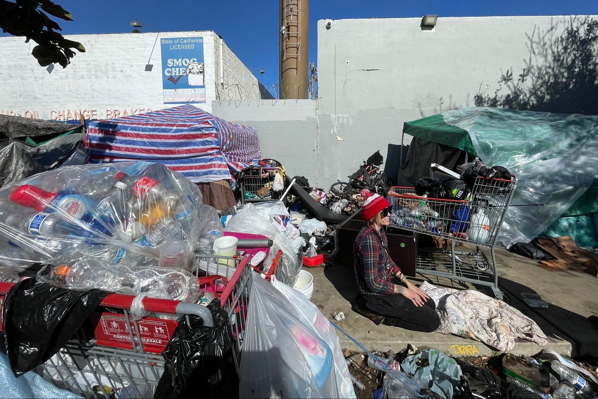 Sodden blankets, swollen hands and police sweeps: Surviving on the streets during LA's historic storm