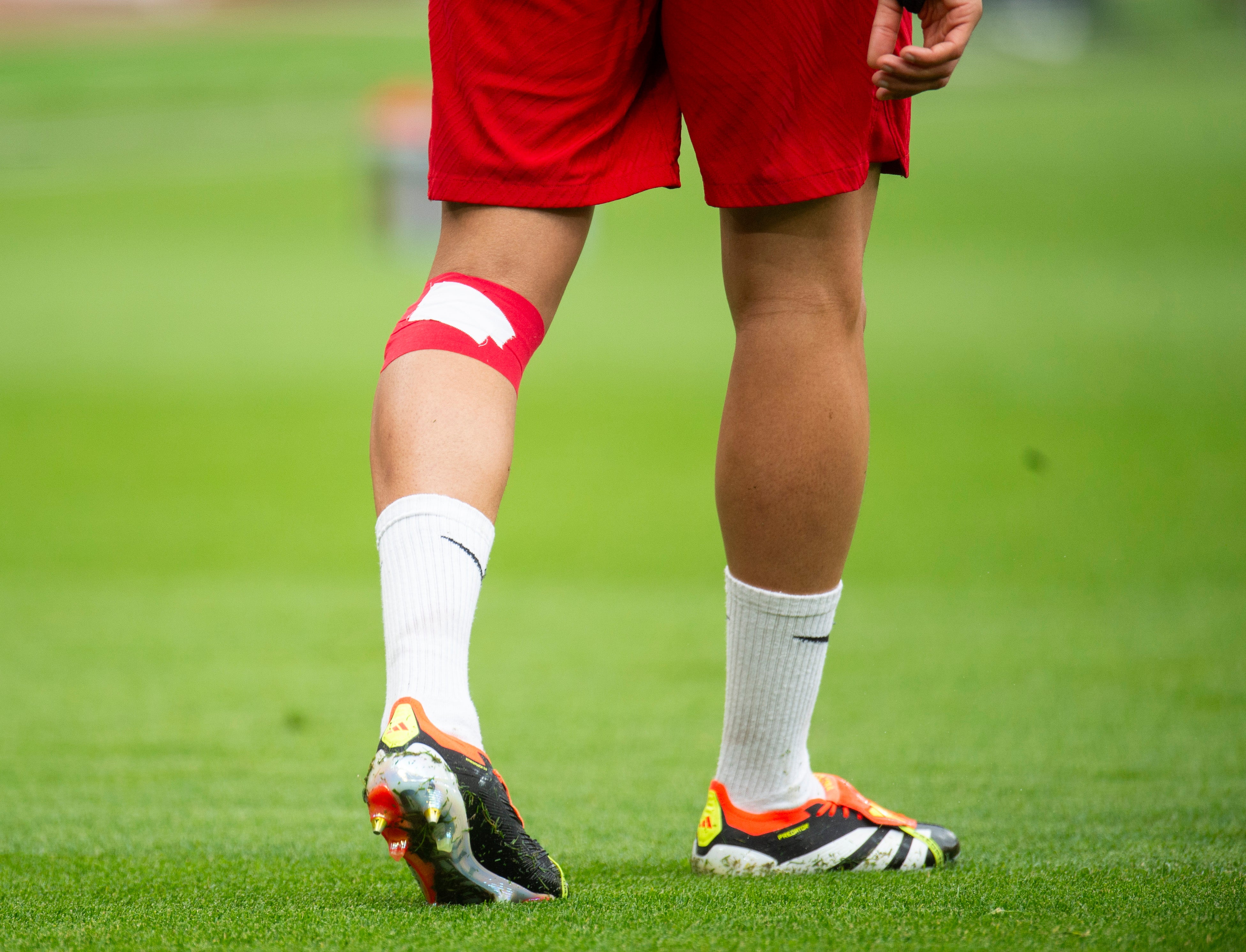 Trent Alexander-Arnold warmed up with strapping on his knee