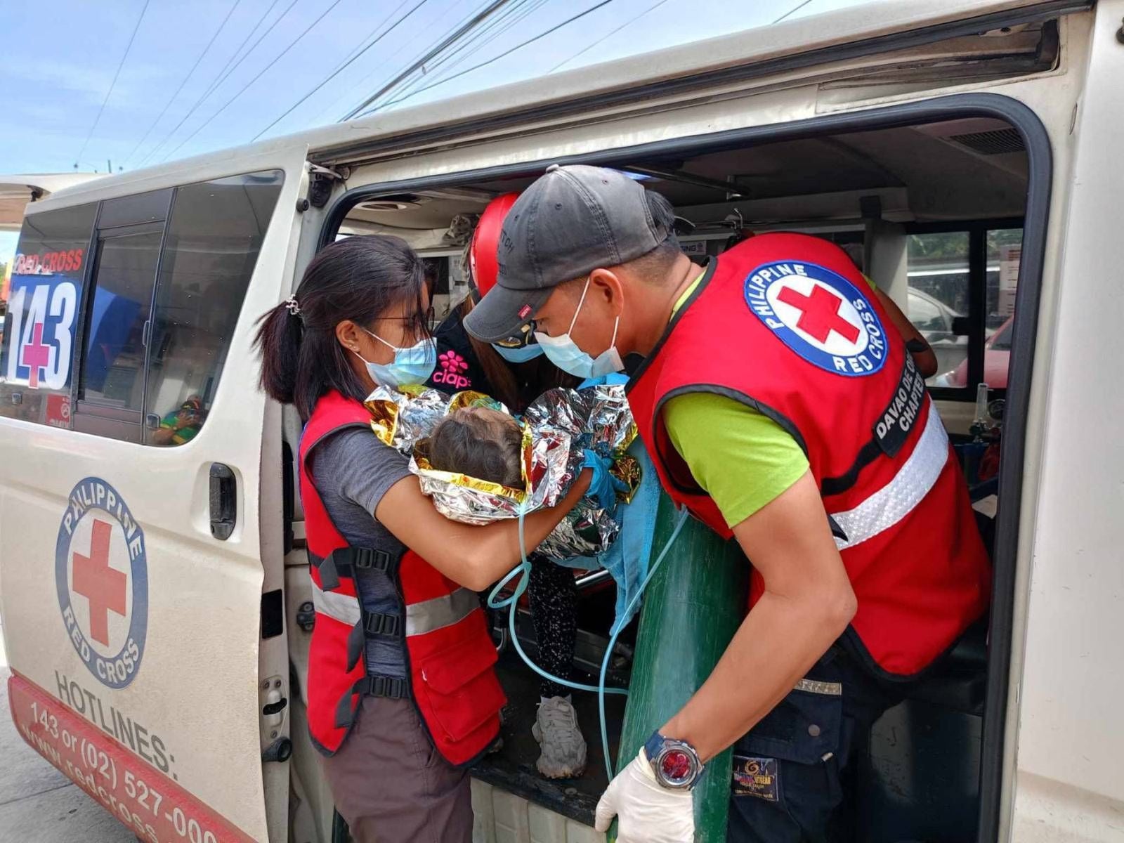 Rescuers save three-year-old girl trapped under Philippines landslide rubble and mud for over 60 hours