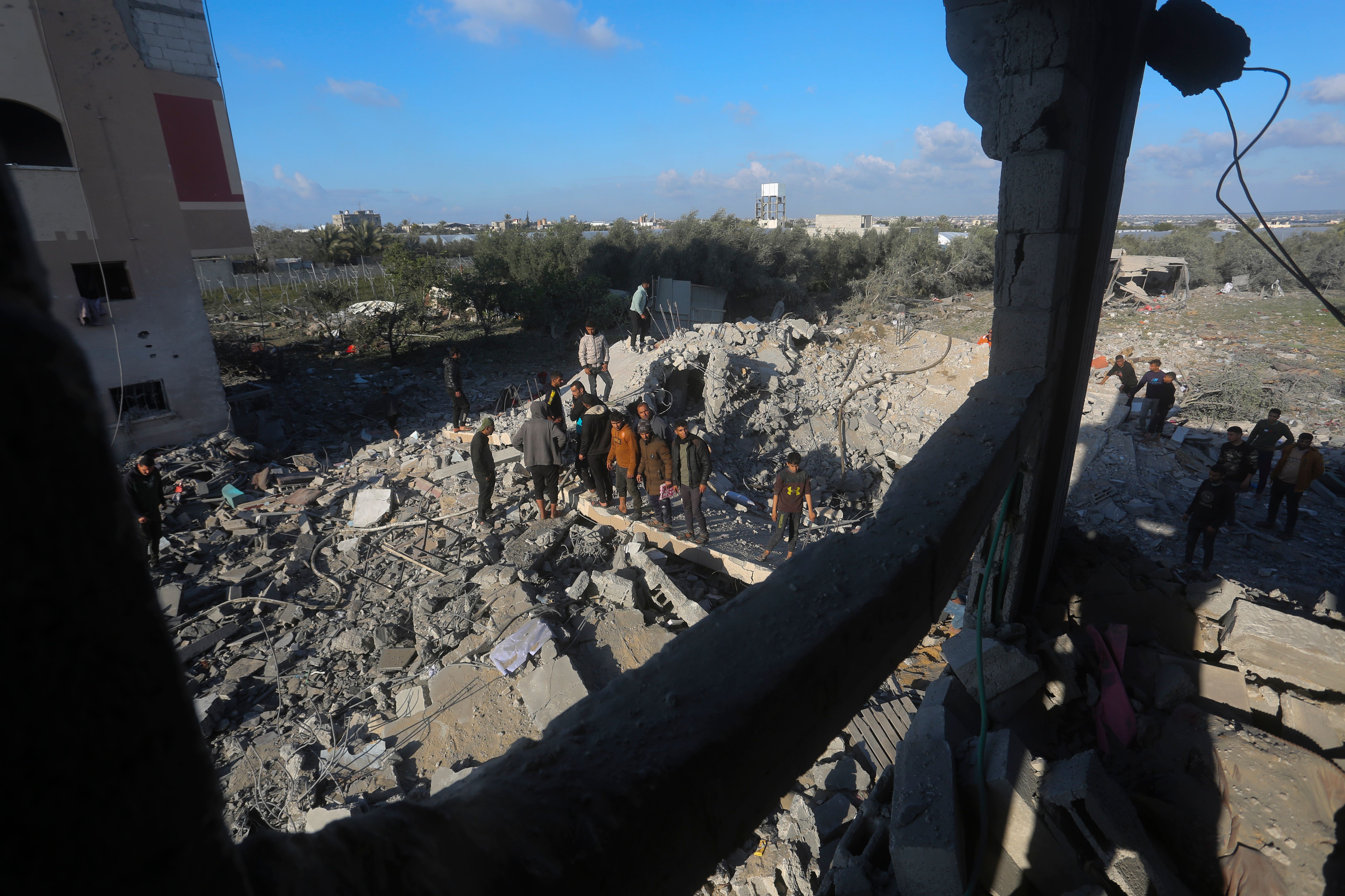 Palestinians search for survivors after an Israeli air strike on a residential building In Rafah (AP/Hatem Ali)