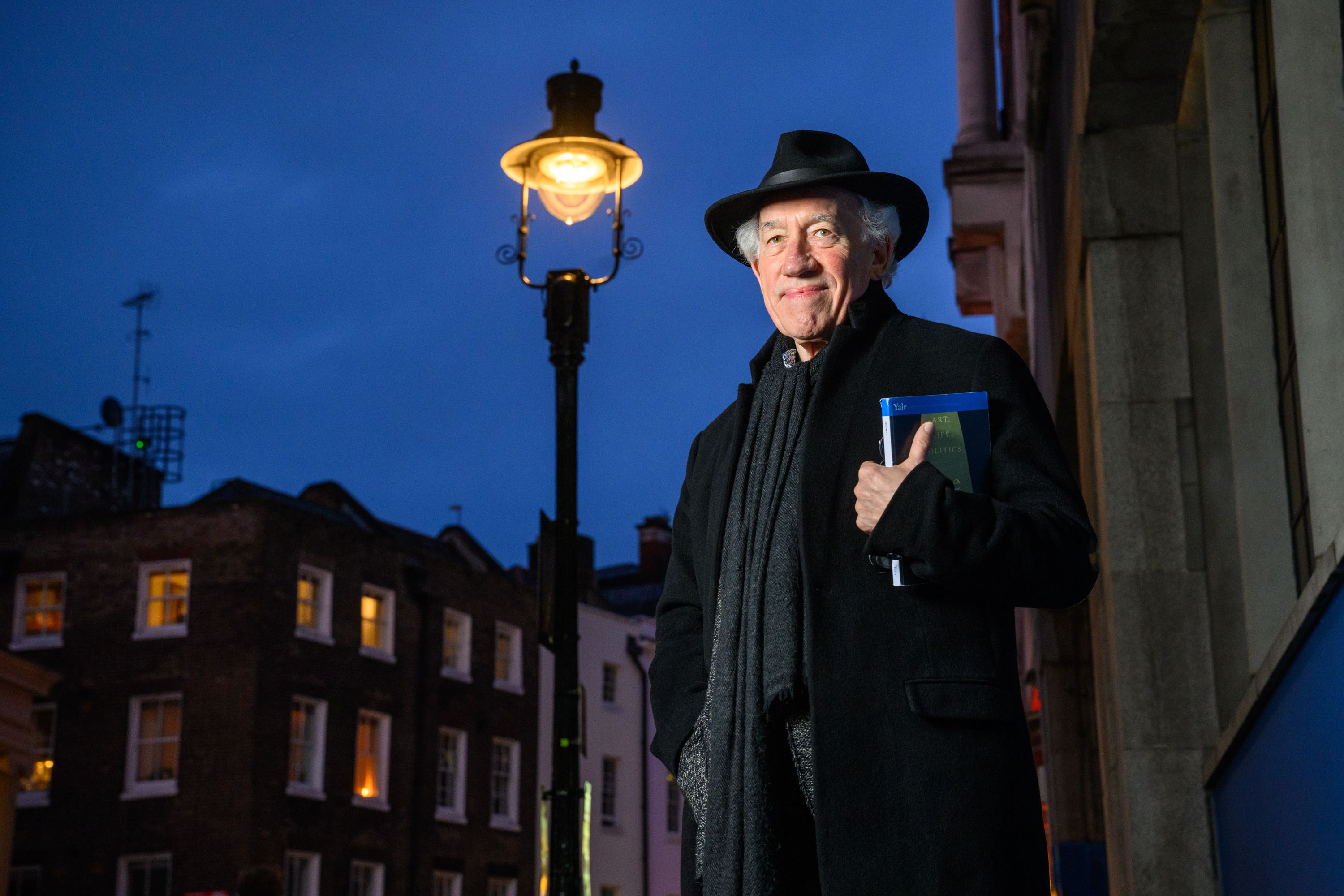 Actor Simon Callow stands under one of four gas lamps along Russell Street in Covent Garden (Matt Crossick/PA)