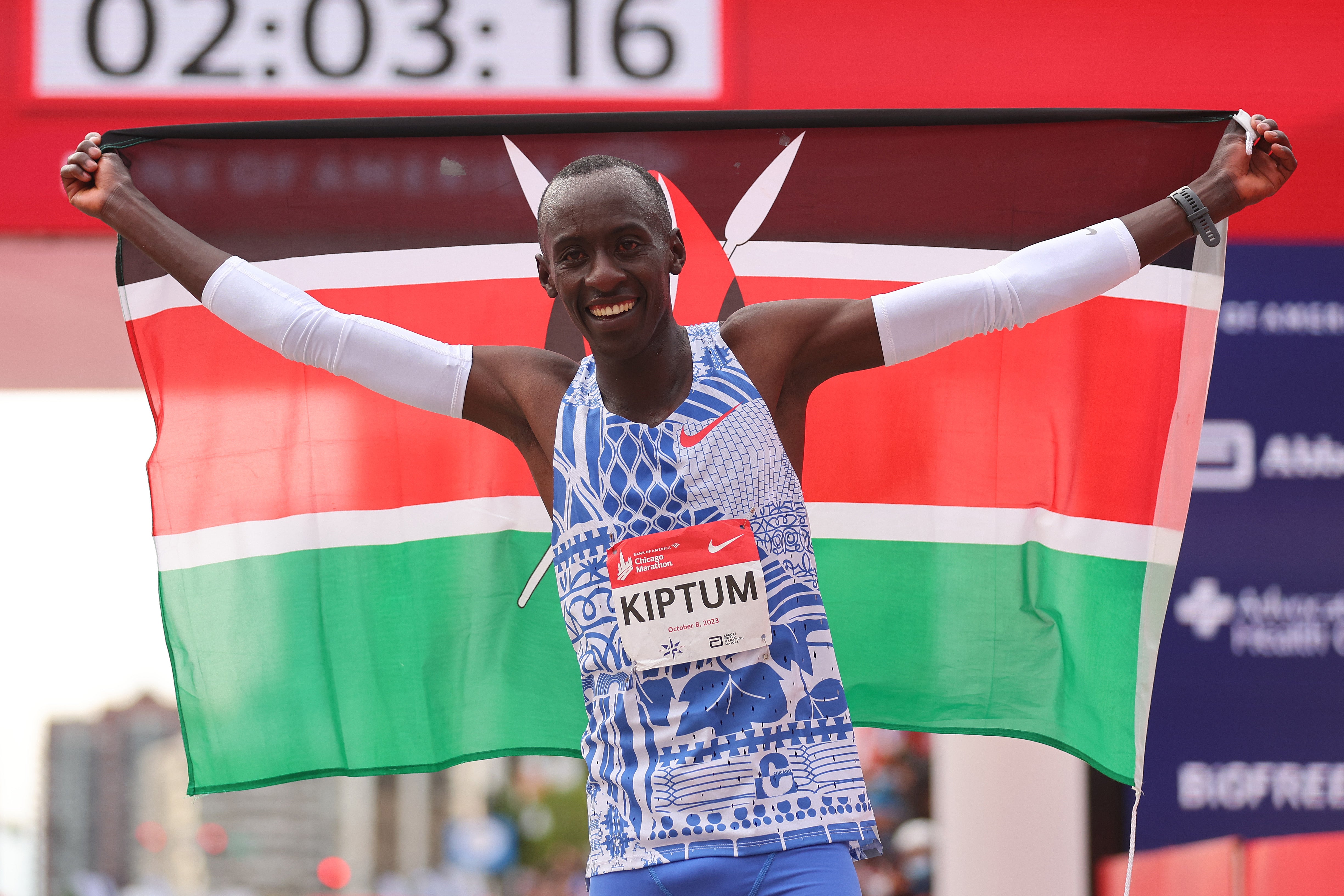 Kelvin Kiptum celebrates after winning the 2023 Chicago Marathon in a world record time