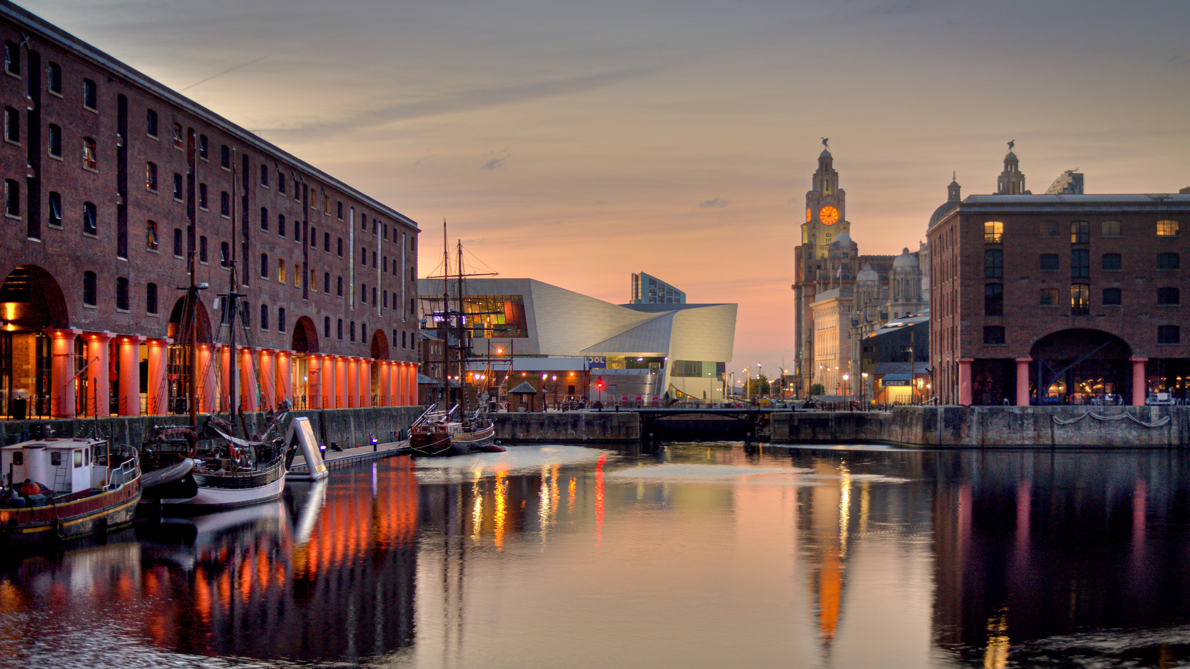 How will Liverpool draw upon its rich history of collective action to address the lack of on-street EV charging points in the city?