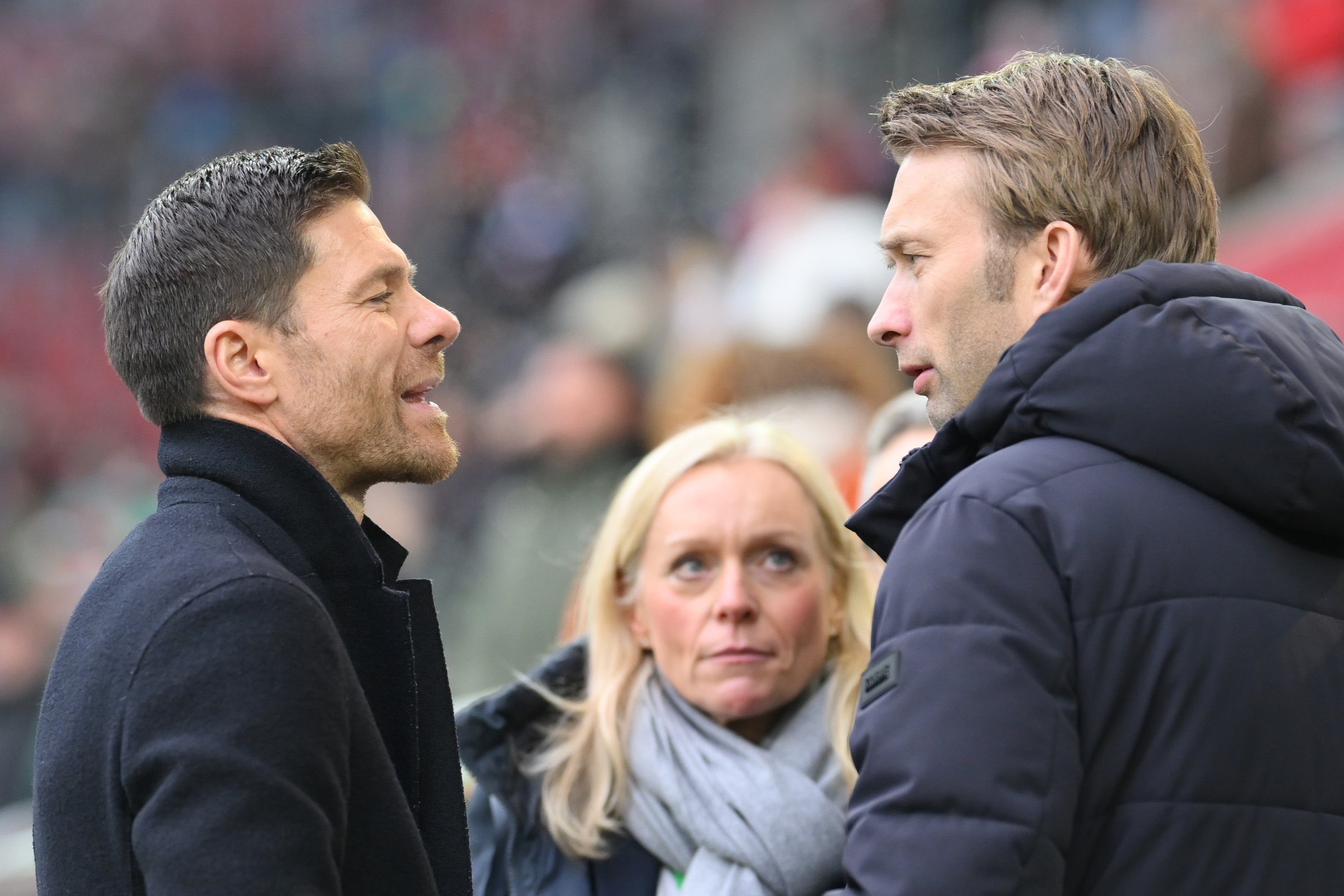 Xabi Alonso (left) with Leverkusen sporting director Simon Rolfes