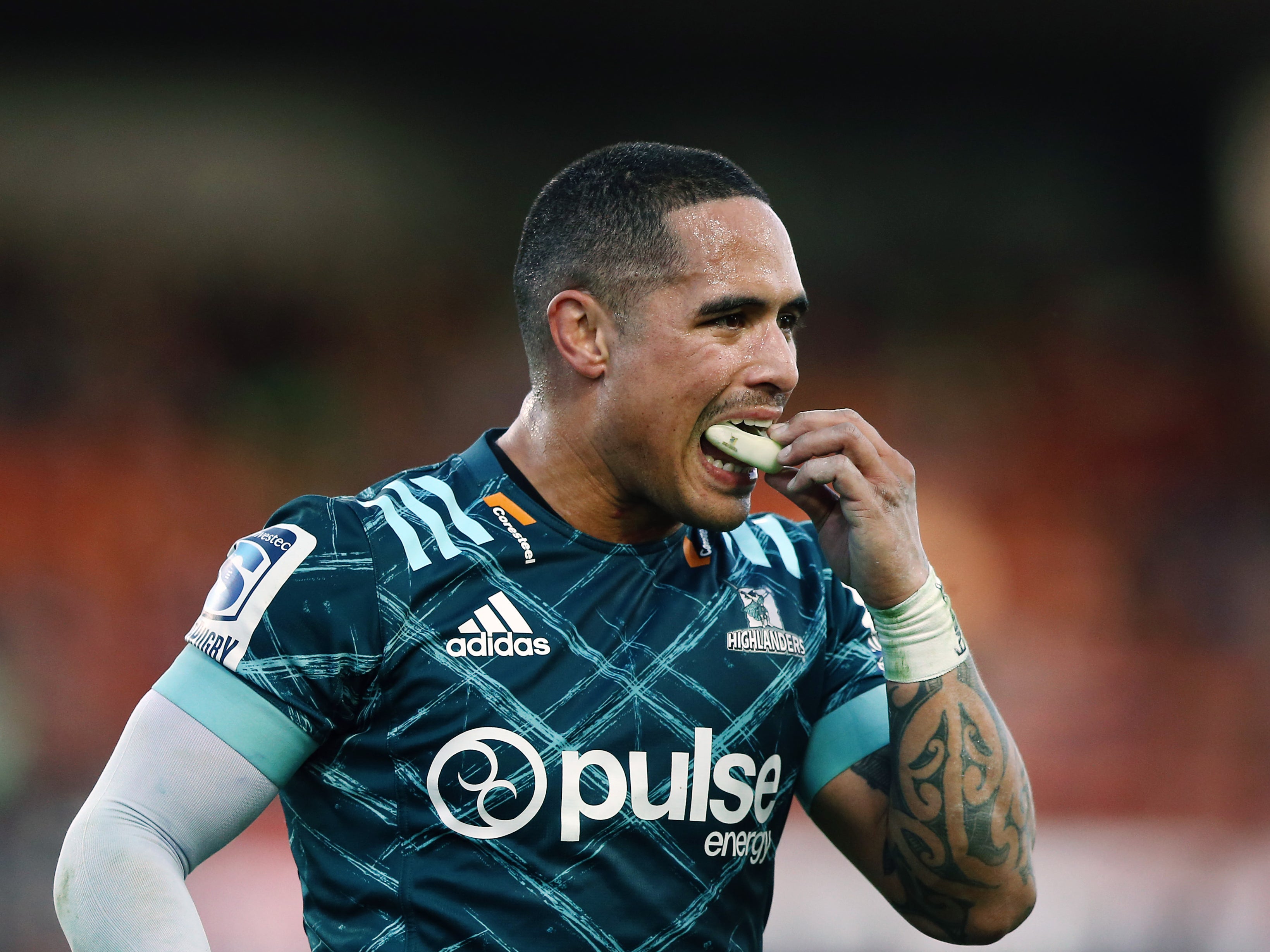 Aaron Smith holds his mouthguard while playing for the Highlanders in New Zealand