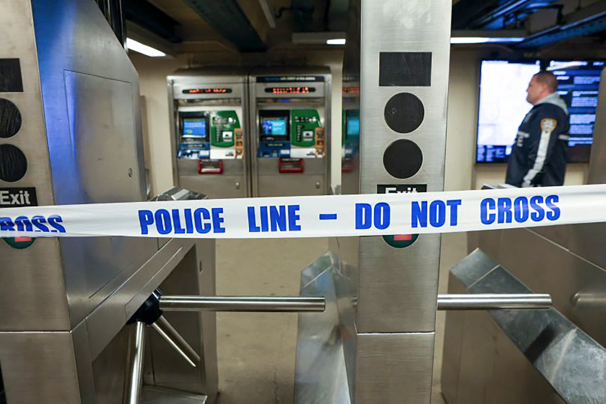 New York Police walk through Mount Eden Avenue subway station while investigating the shooting