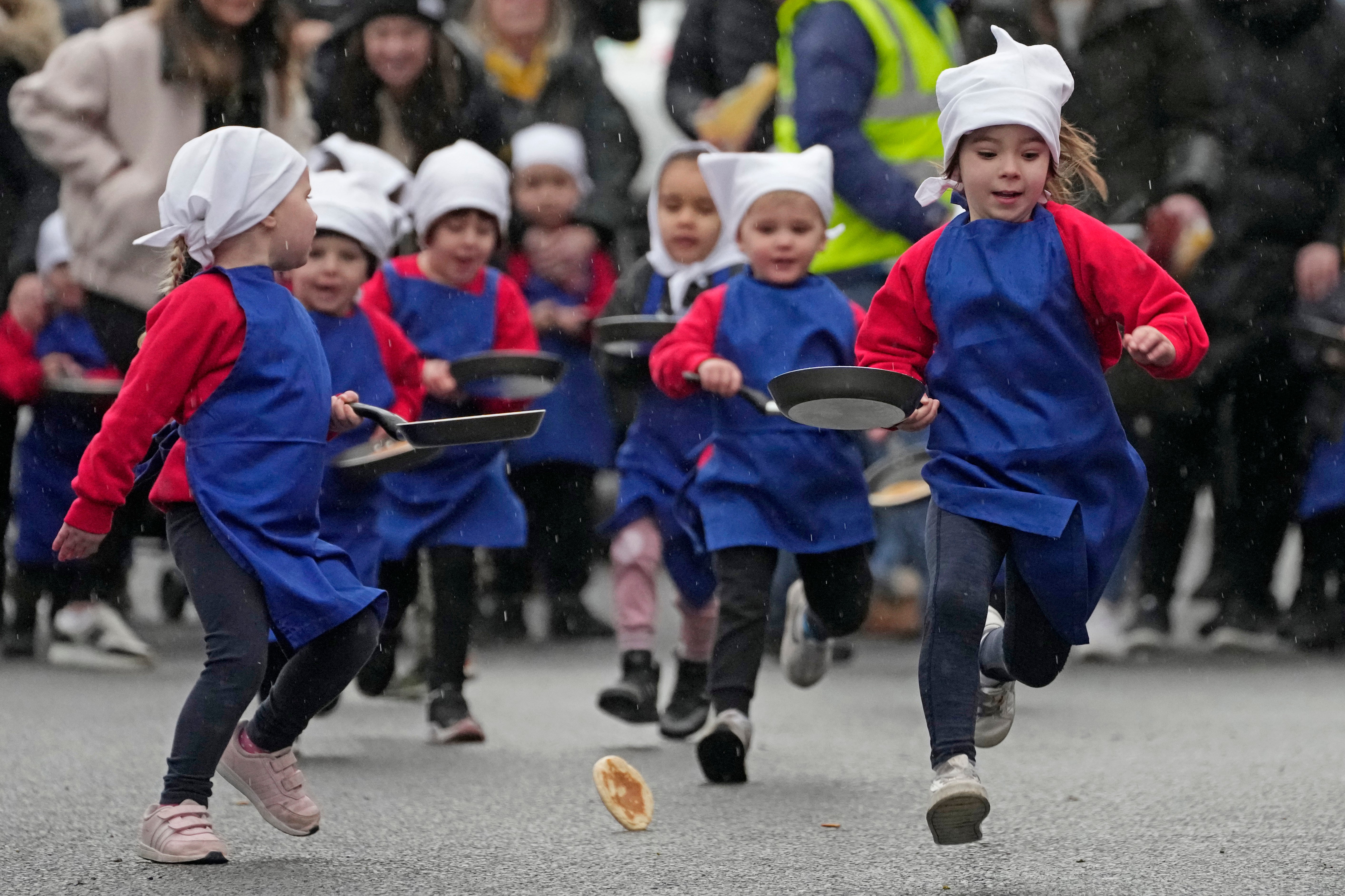 APTOPIX Britain Pancake Race