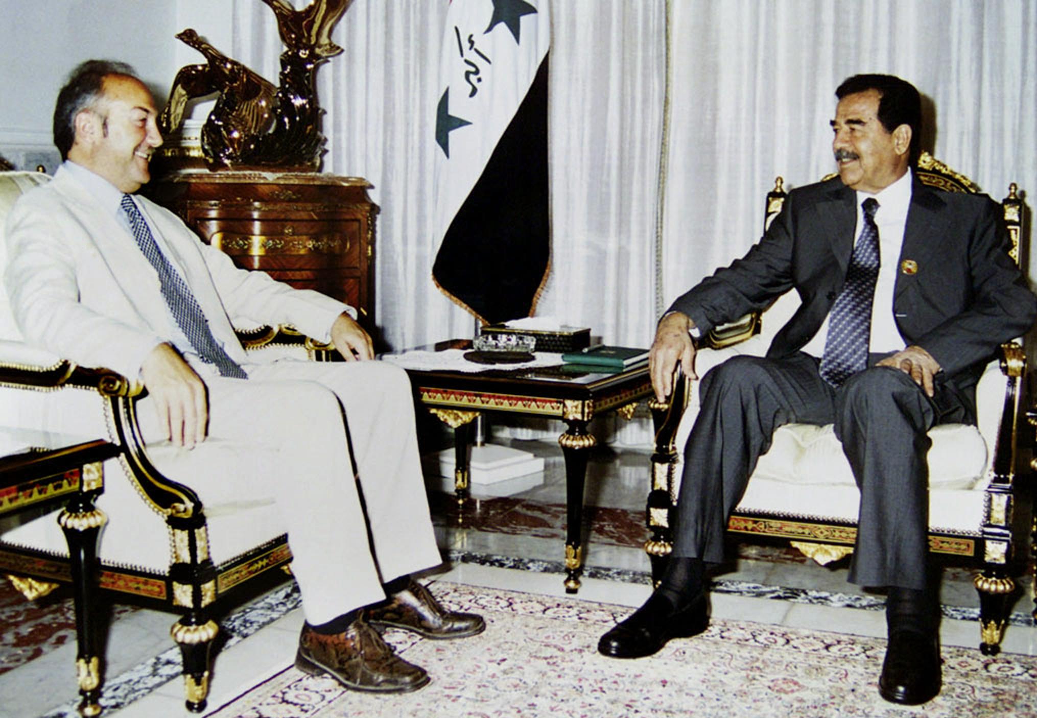 Galloway sits with Saddam Hussein in a meeting with the Iraqi dictator condemned by many in the West