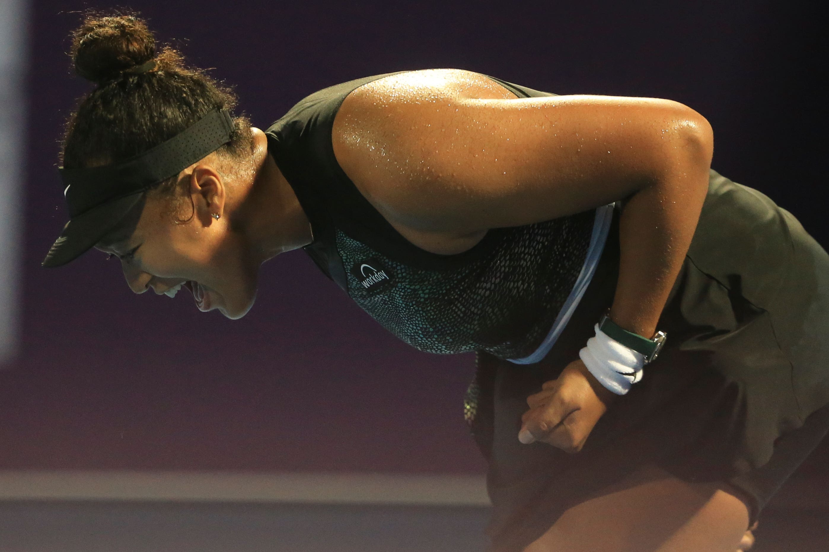 Naomi Osaka reacts during her win over Petra Martic (Hussein Sayed/AP)