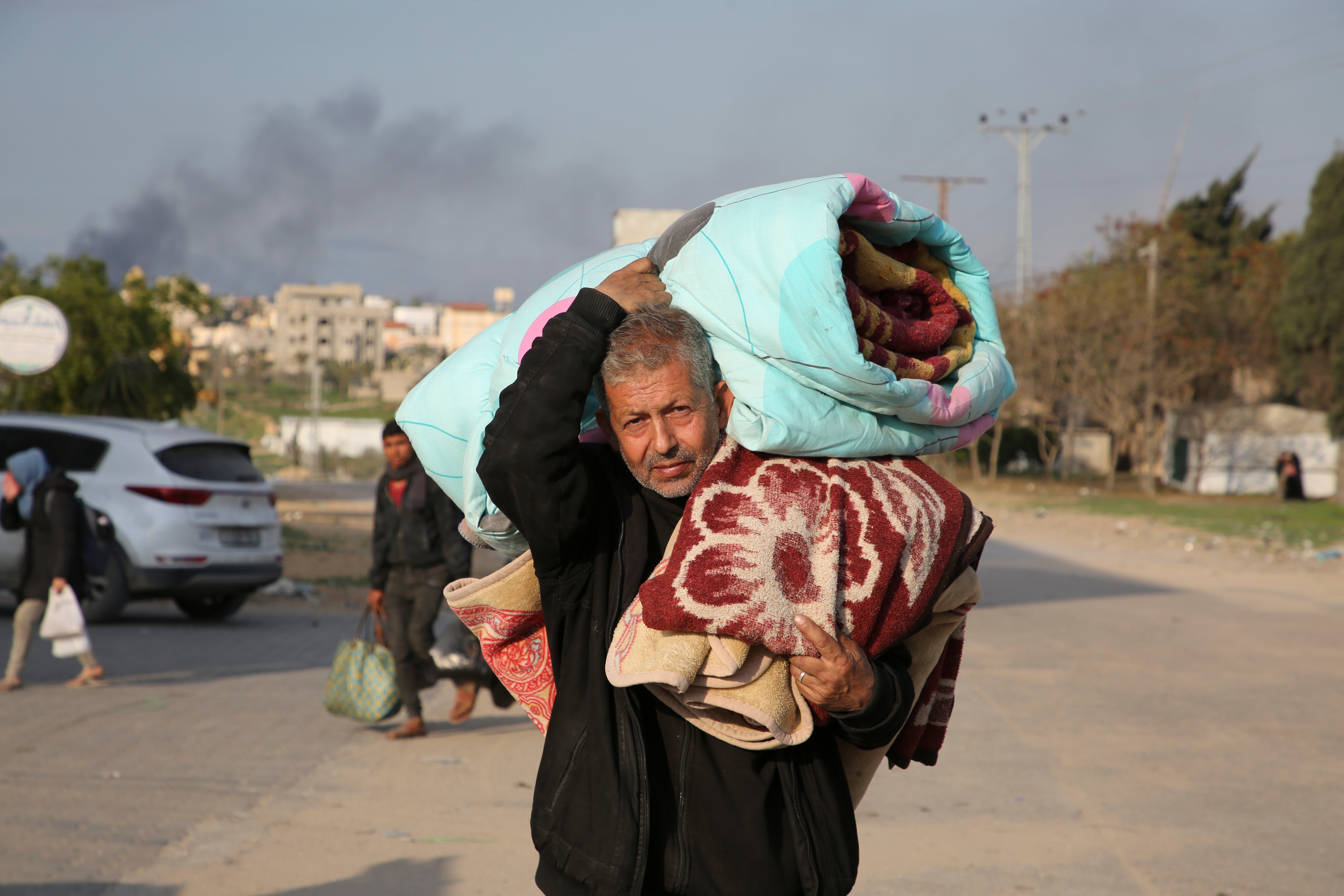 Palestinians fleeing the Israeli offensive on Khan Younis arrive at Rafah, Gaza Strip