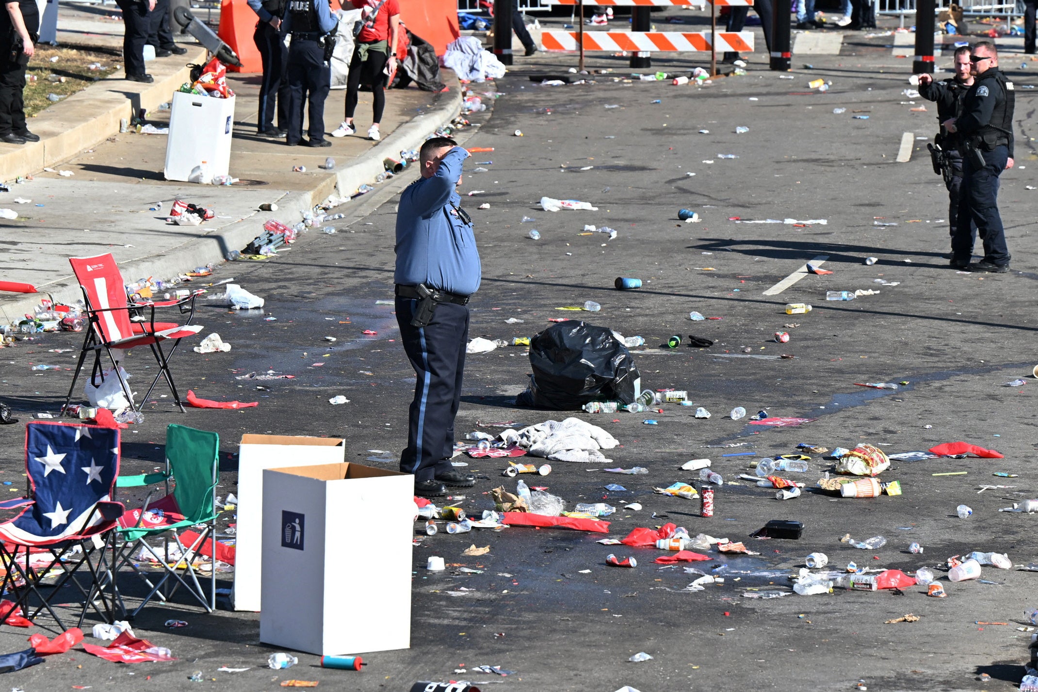Police clear the area after shots were fired after the celebration of the Kansas City Chiefs winning Super Bowl LVIII.