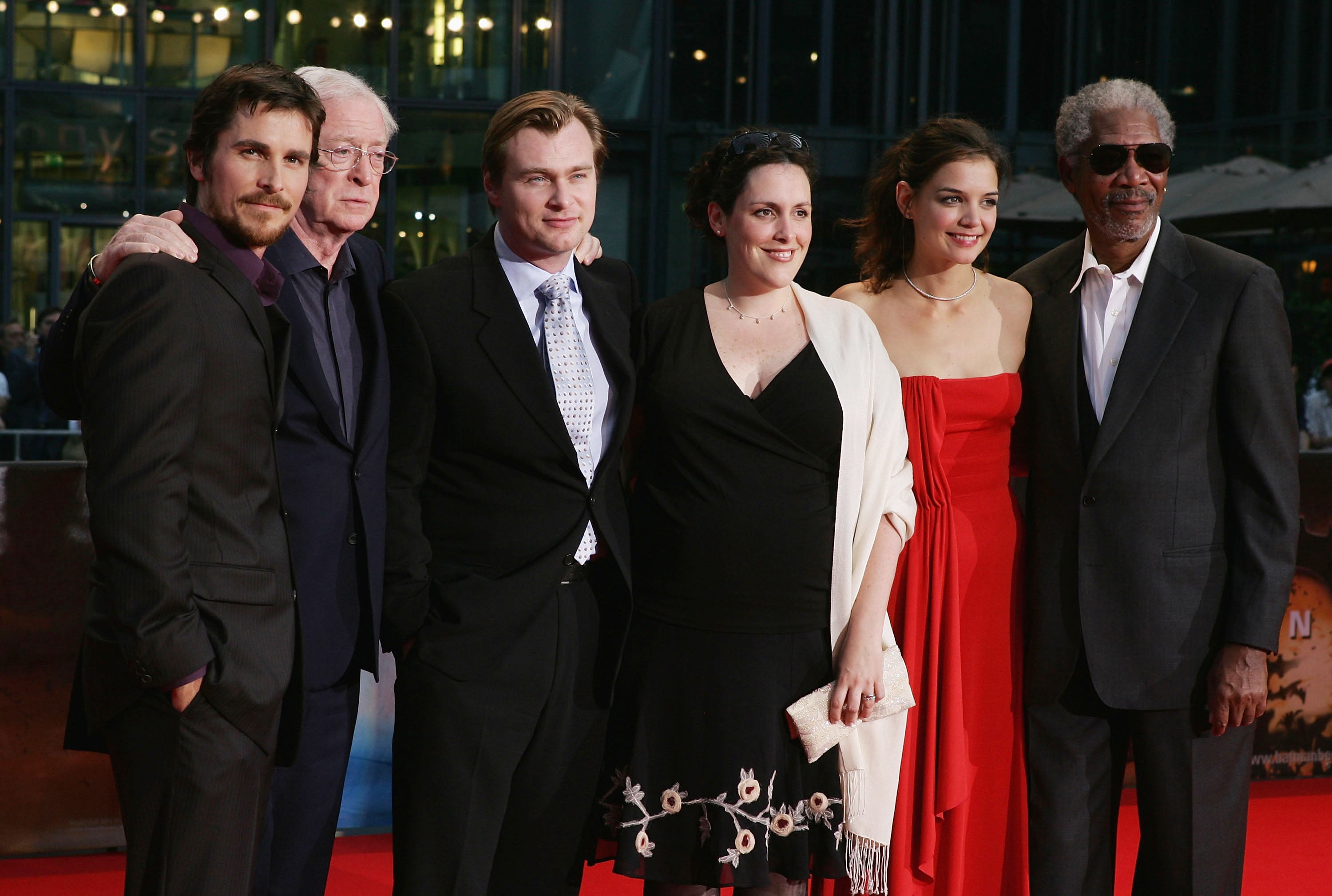 L-R: Christian Bale, Michael Caine, Christopher Nolan, Emma Thomas, Katie Holmes and Morgan Freeman arrive for the German premiere of ‘Batman Begins’, June 2005