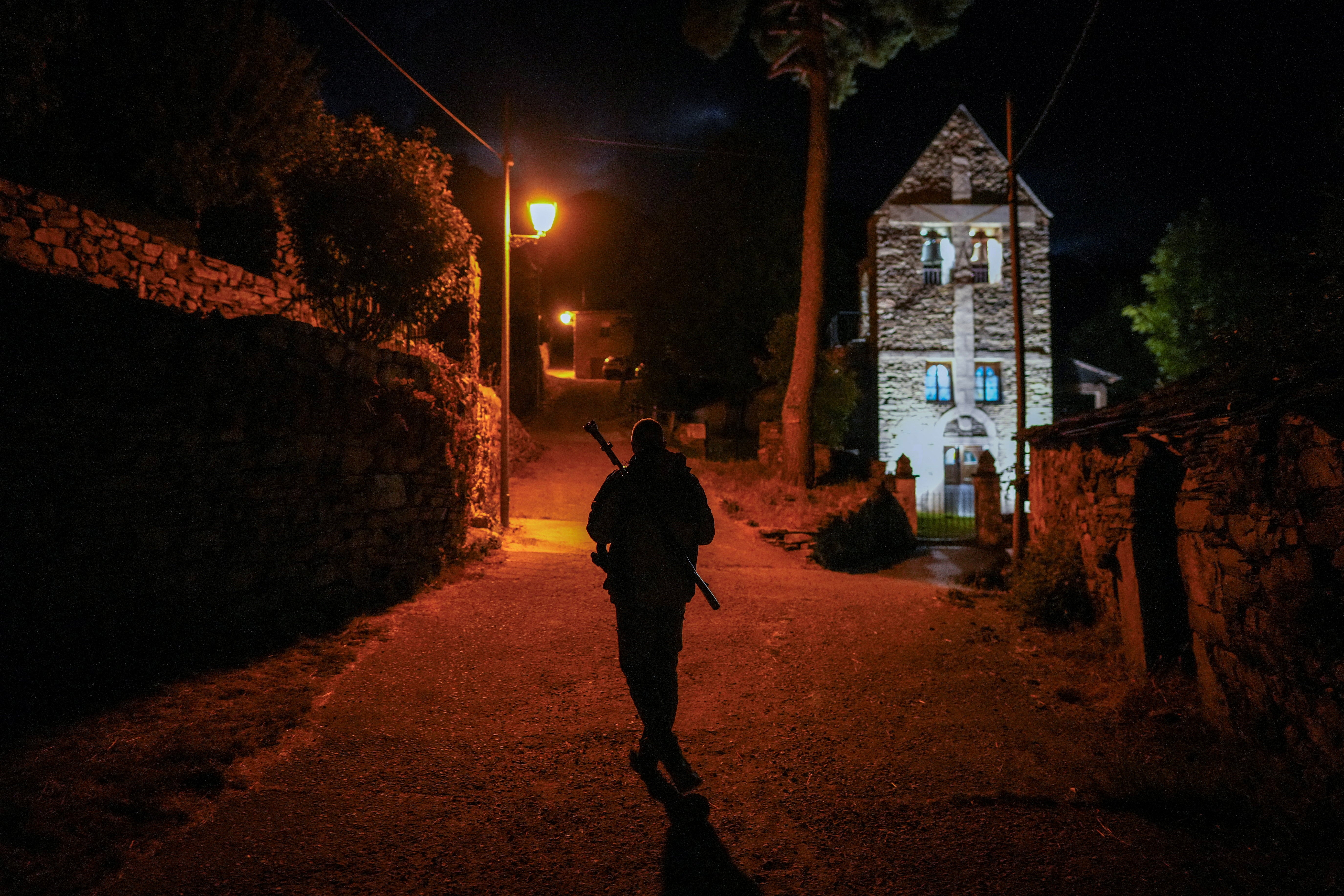 Pedro Garcia, an Alto Sil bear patrol member, investigates after receiving a call about a spotted Iberian brown bear in the village of Salientes