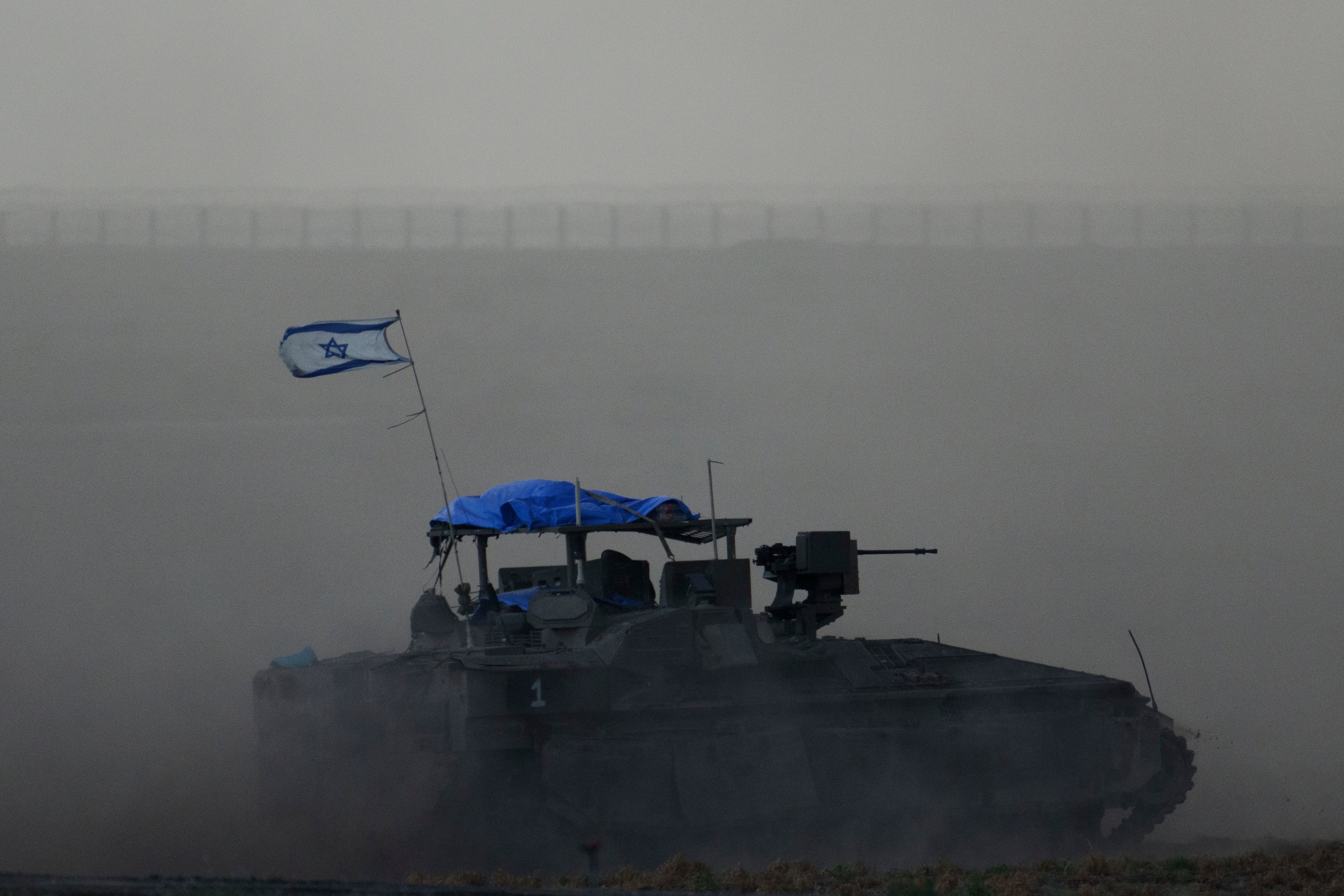 Israeli armored vehicle moves near the Israeli-Gaza border, as seen from southern Israel