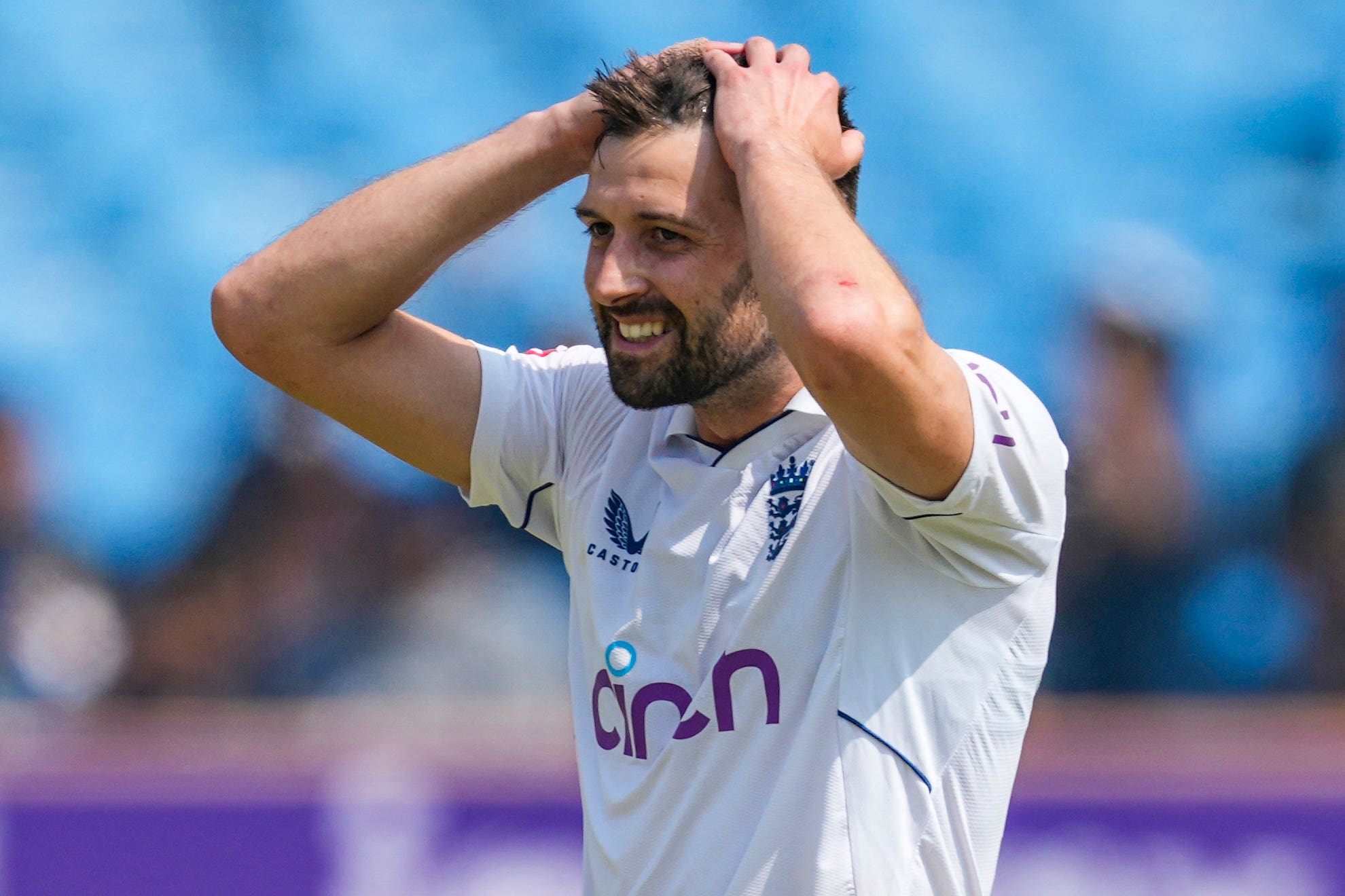 Mark Wood reacts after seeing Ben Stokes drop Ravichandran Ashwin (AP Photo/Ajit Solanki)