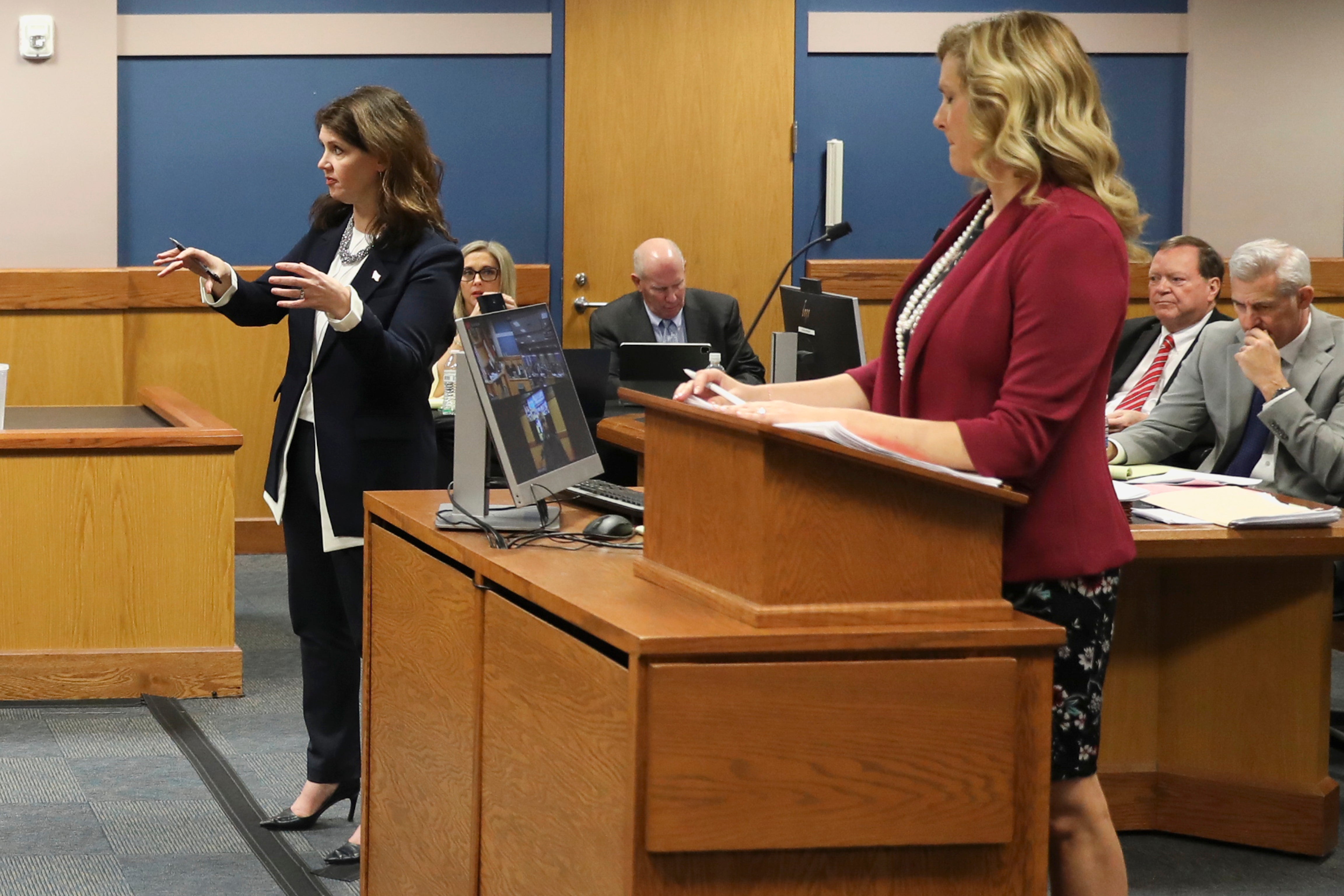 Fulton County special prosecutor Anna Cross, left, who represents Fani Willis, appears alongside defence attorney Ashleigh Merchant, right, during a hearing on 16 February