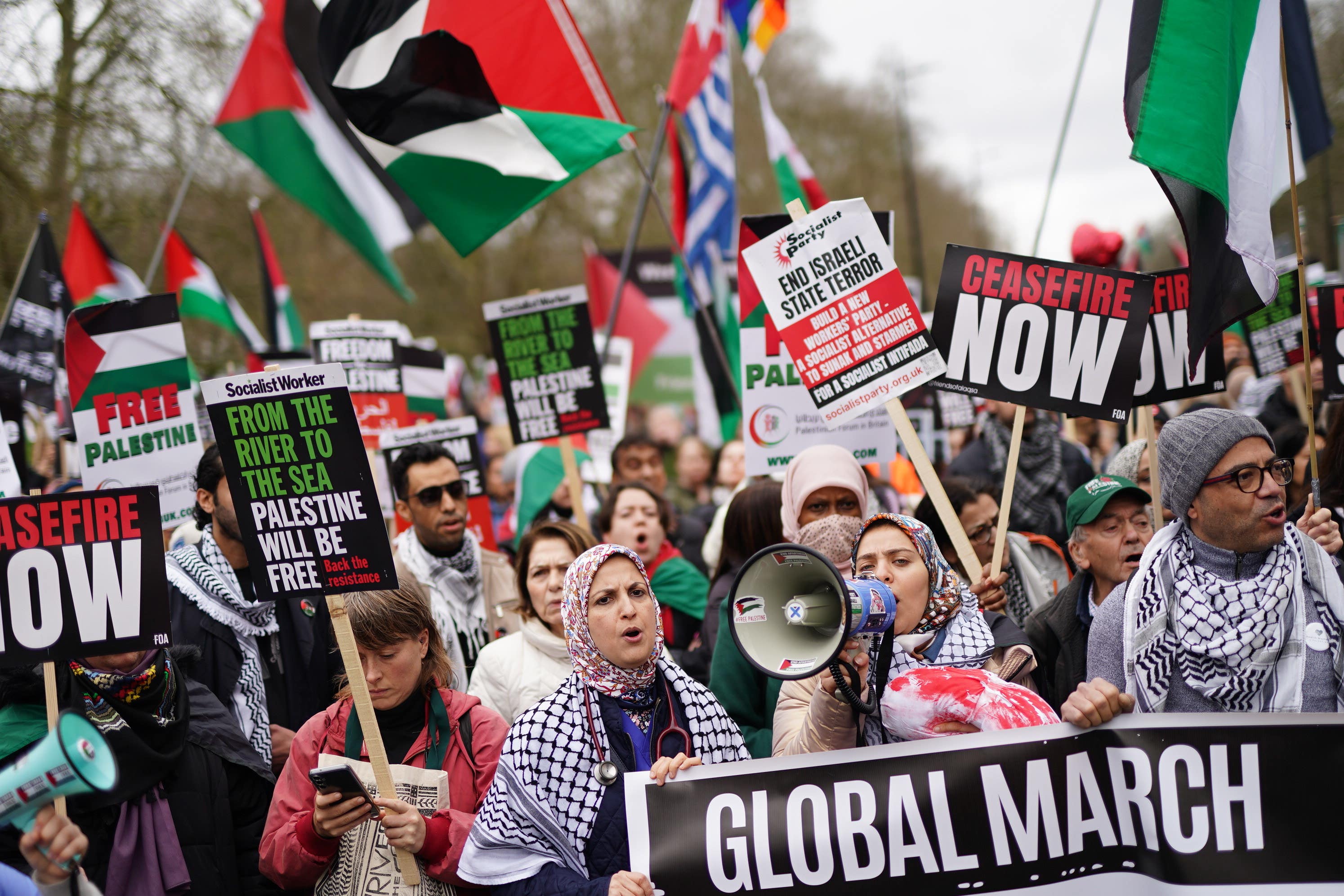 People take part in a pro-Palestine demonstration in central London