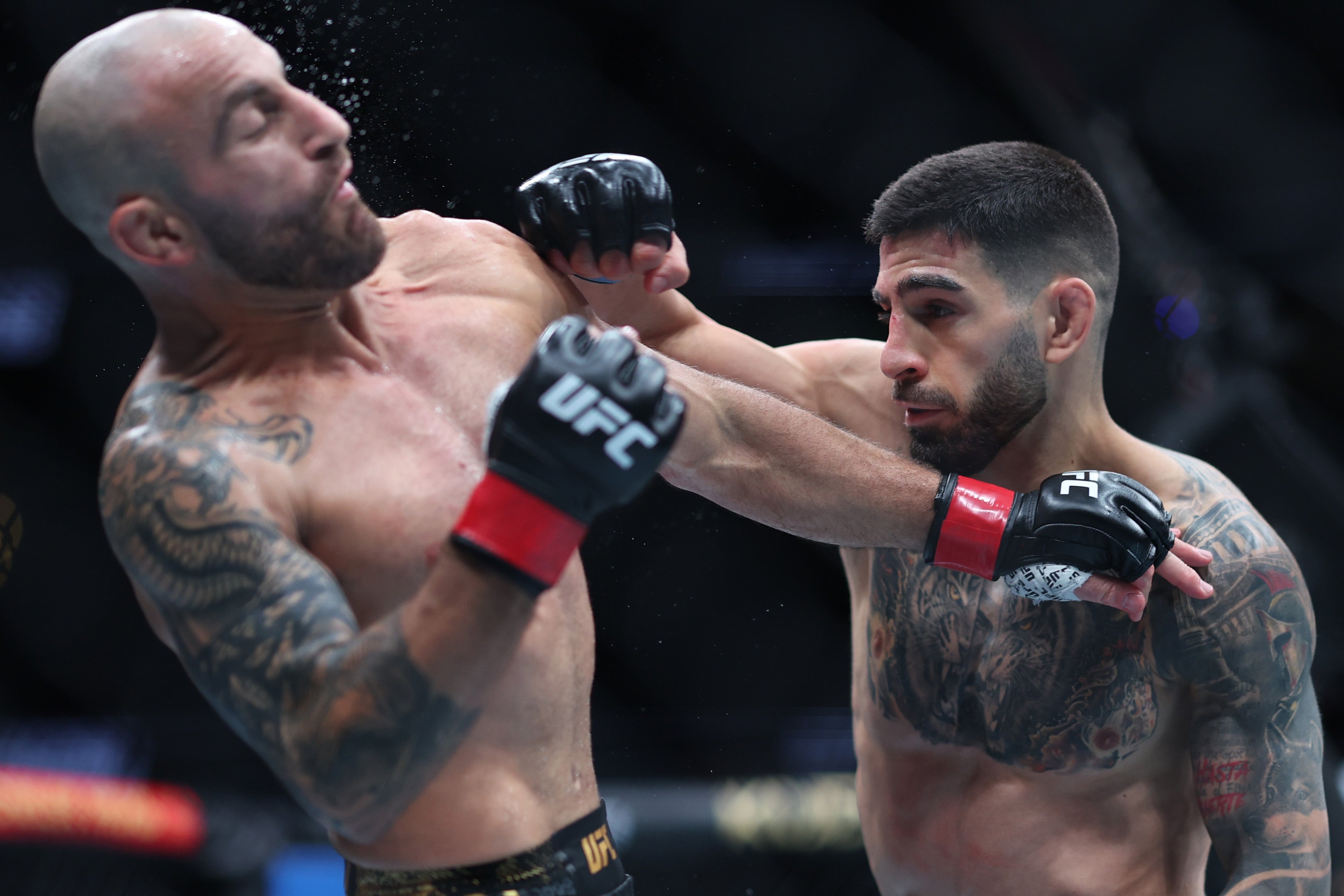 Ilia Topuria (right) knocked out Alexander Volkanovski to win the 145lb title in February