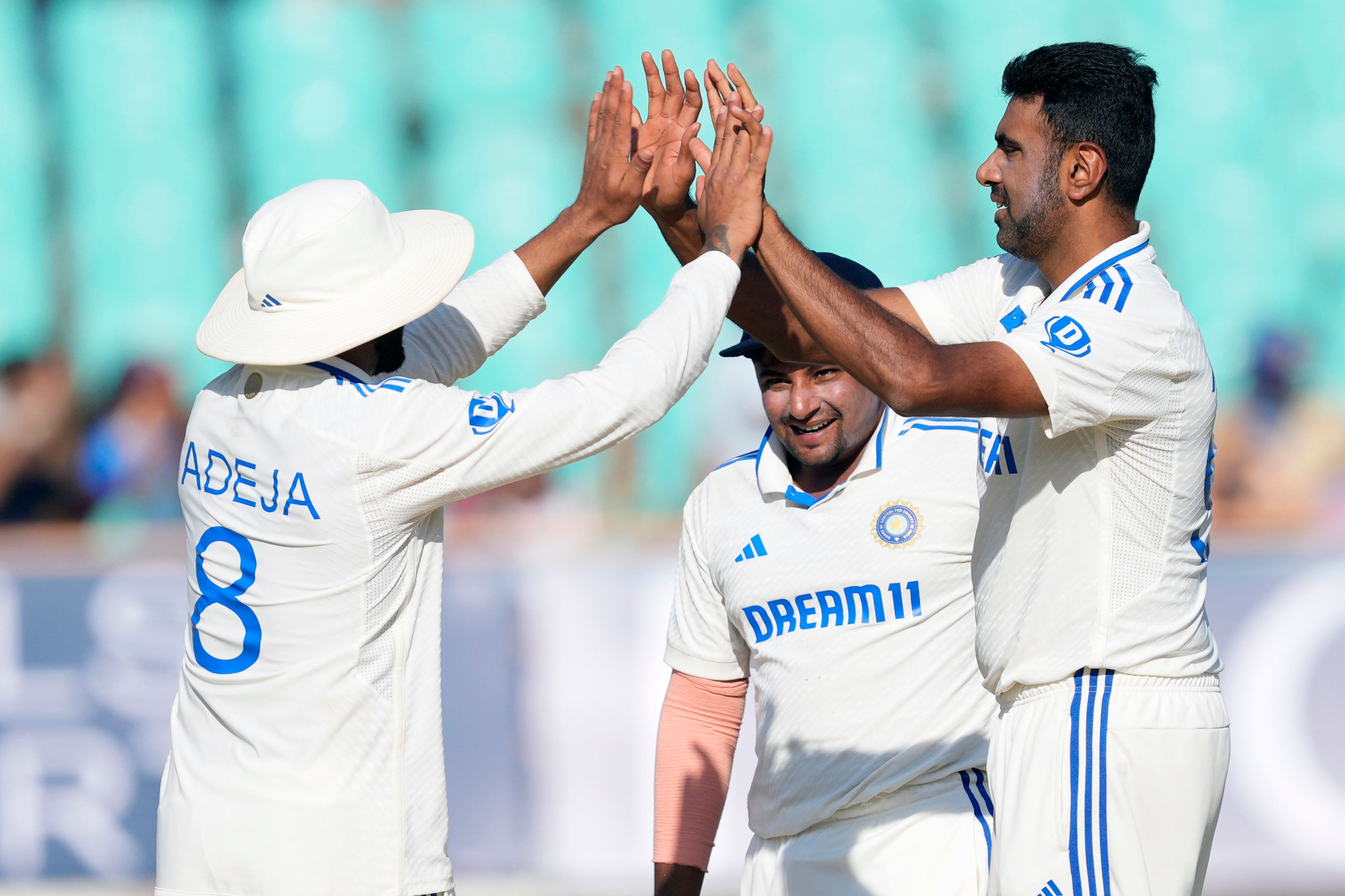 Ravichandran Ashwin, right, celebrates the wicket of England’s Tom Hartley on the fourth day of the third Test (Ajit Solanki/AP)