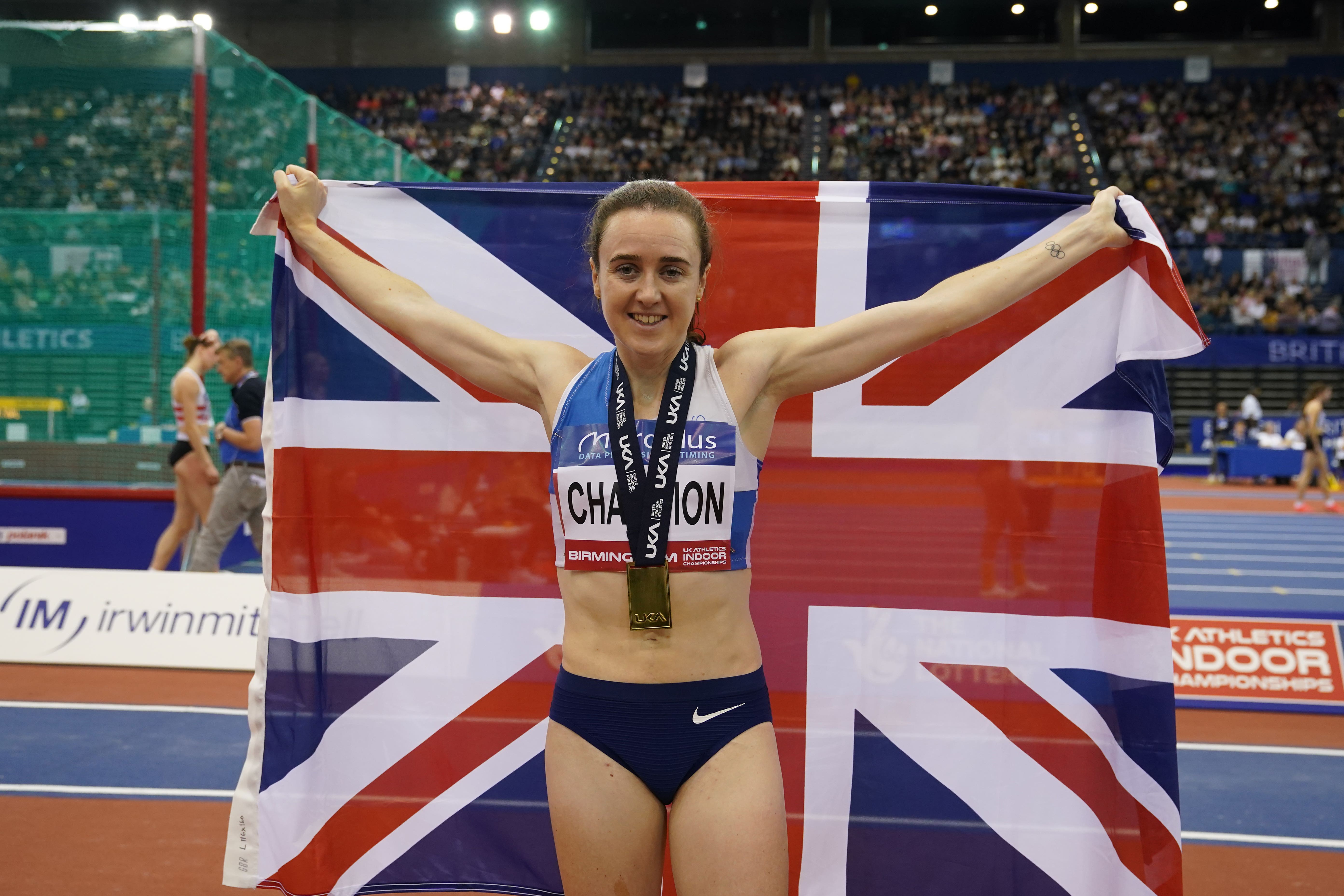 Laura Muir celebrates with her medal after winning the 3000m. (Martin Rickett/PA)