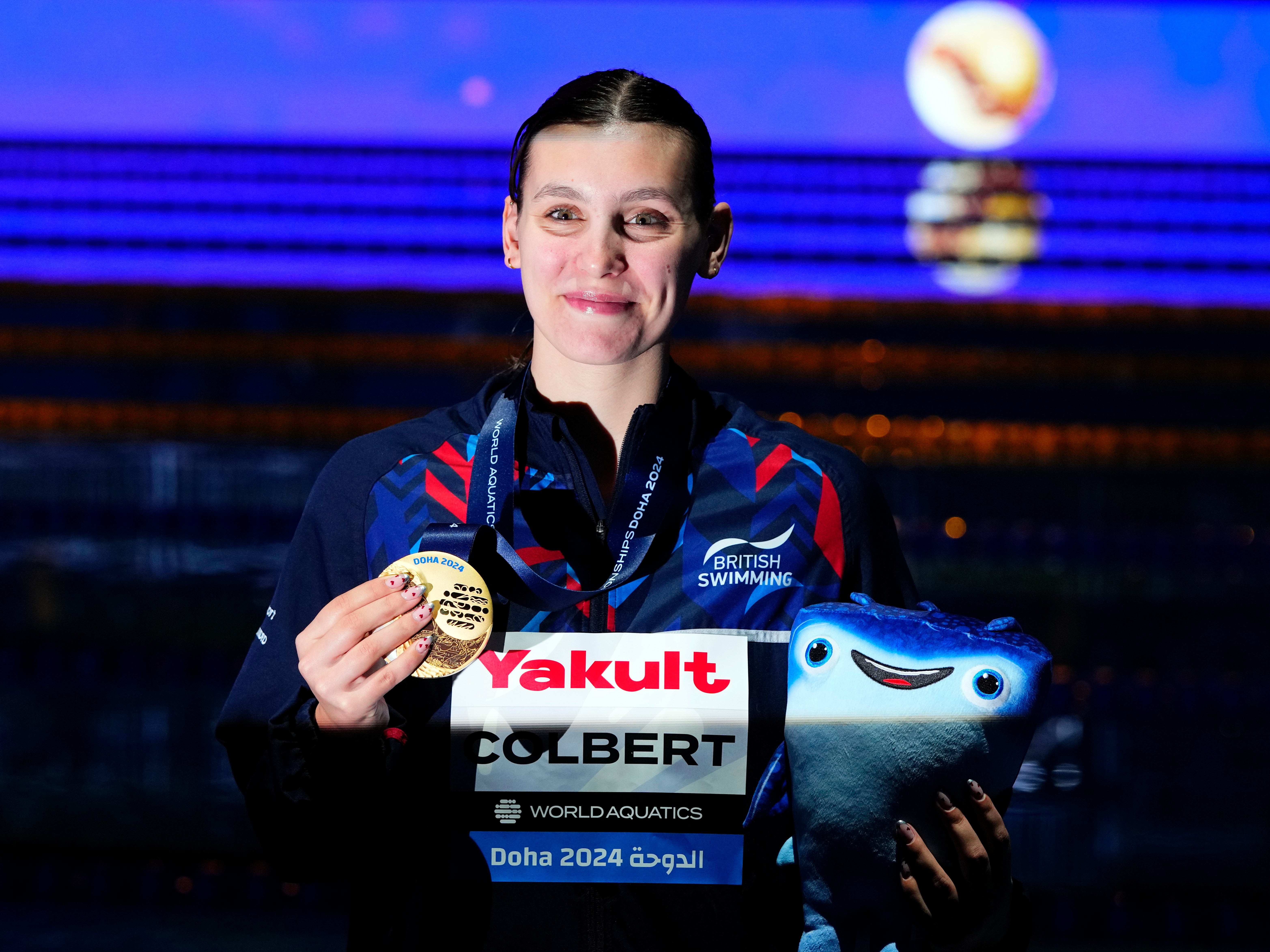 Freya Colbert of Great Britain poses after winning the gold medal in the Women’s 400m Individual Medley final at the World Aquatics Championships