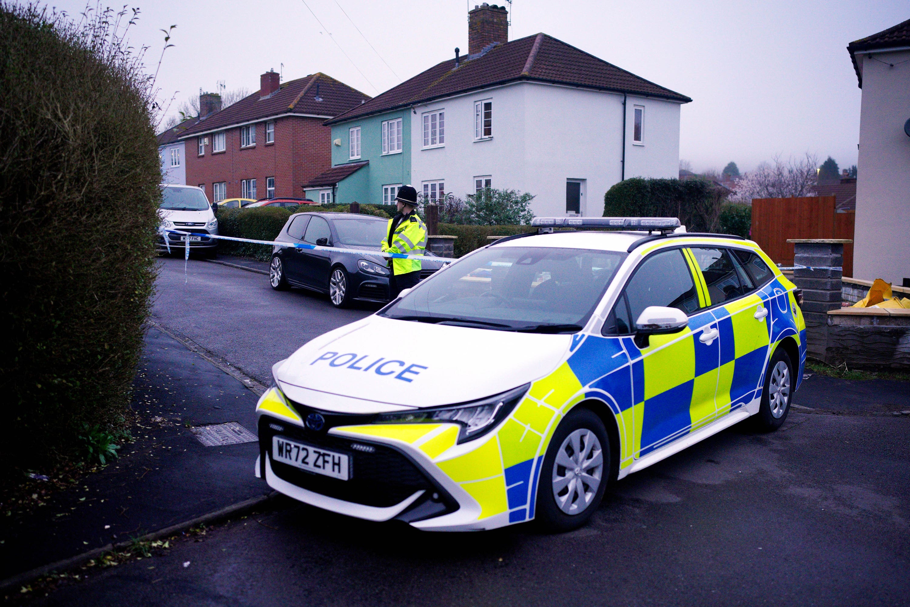 Police at the scene after three children were found dead at a house in Bristol (Ben Birchall/PA)