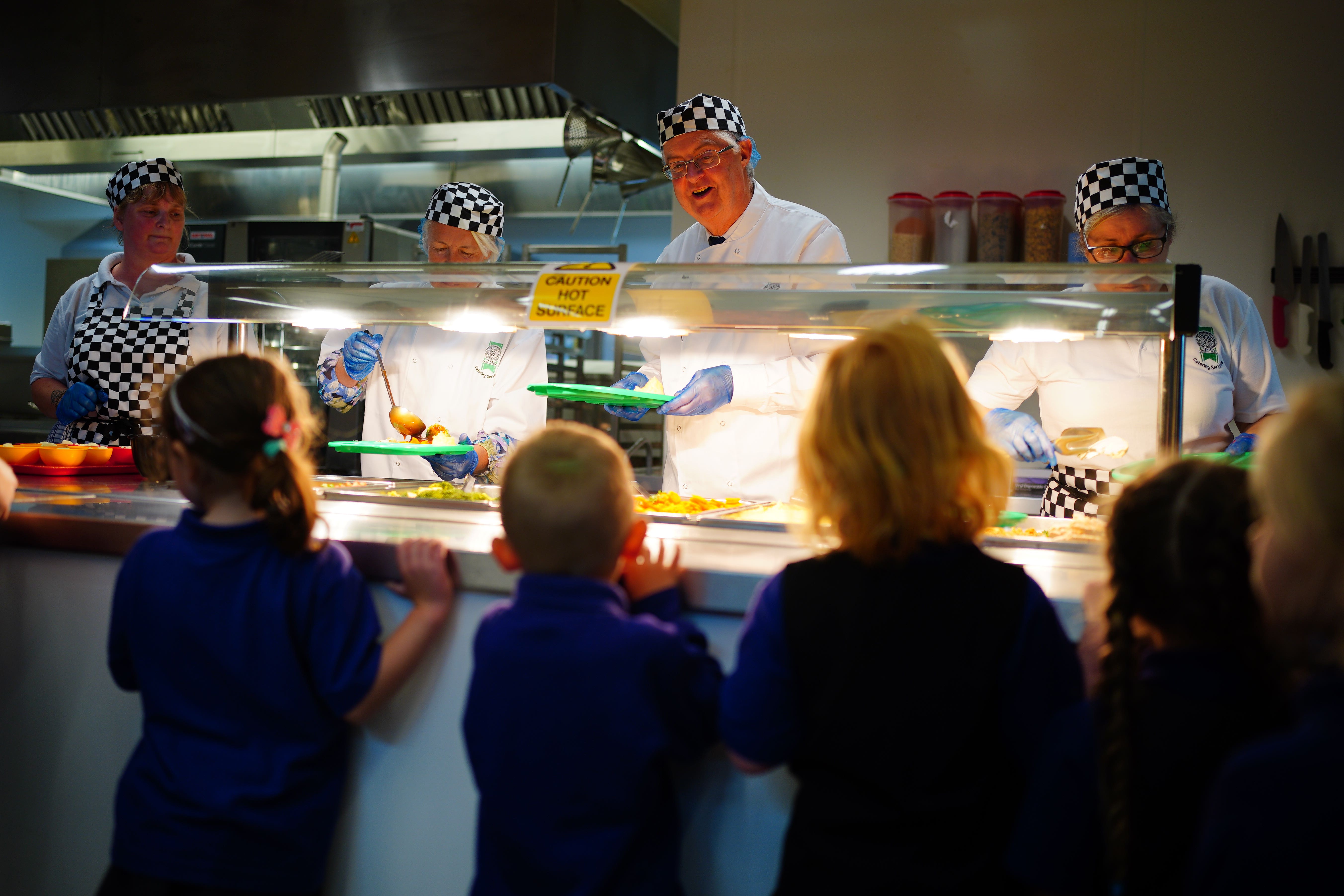 First Minister of Wales Mark Drakeford serves lunches at Ysgol Y Preseli in Pembrokeshire (Ben Birchall/PA)