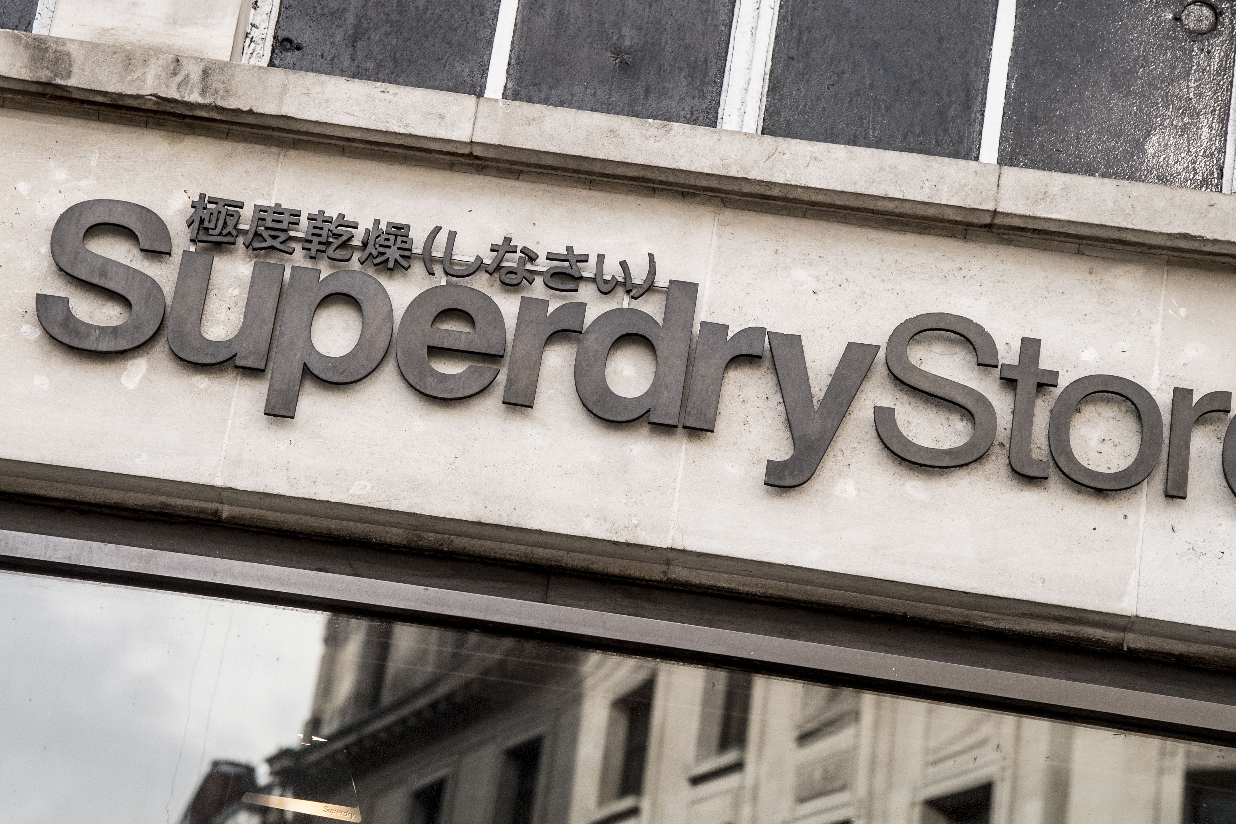 Superdry shares lifted on reports a US investor is in talks with the group’s founder over a possible takeover move (Ian West/PA)