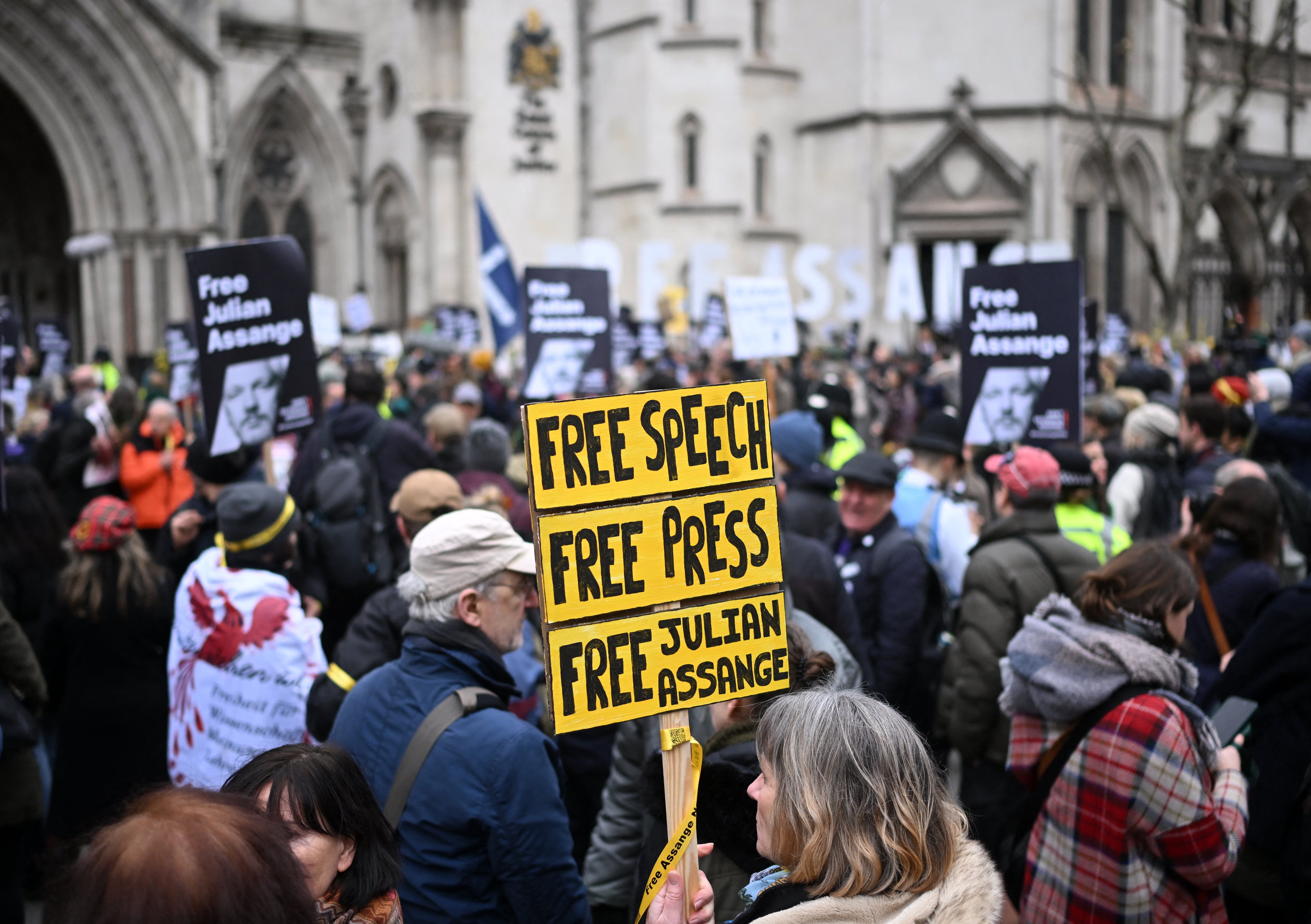 Demonstrators show their support to Assange before the appeal hearing on Tuesday morning