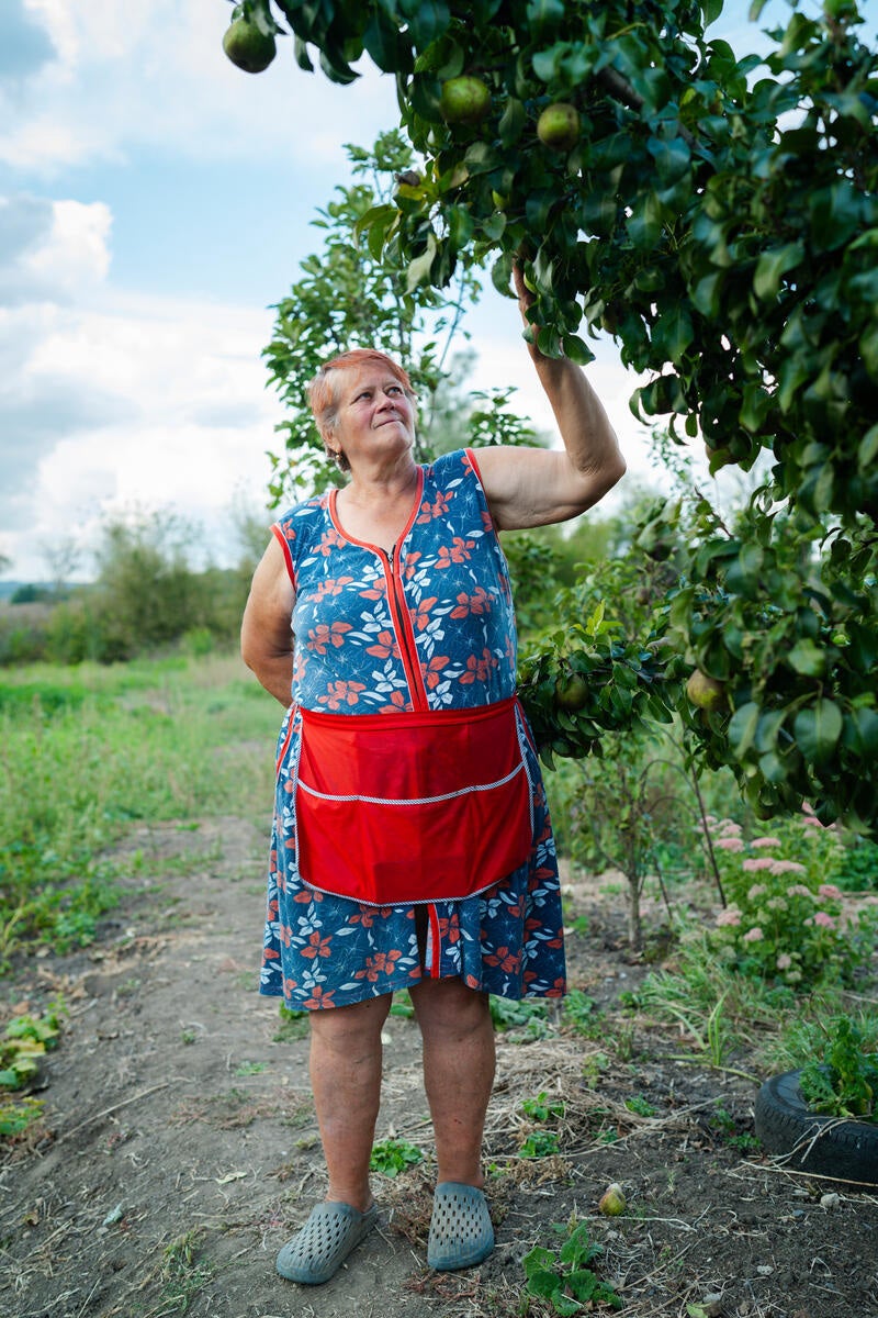 Tetiana was evacuated from Kamianka in March 2022. On returning a year later, she couldn’t bear seeing the damage to her house and yard