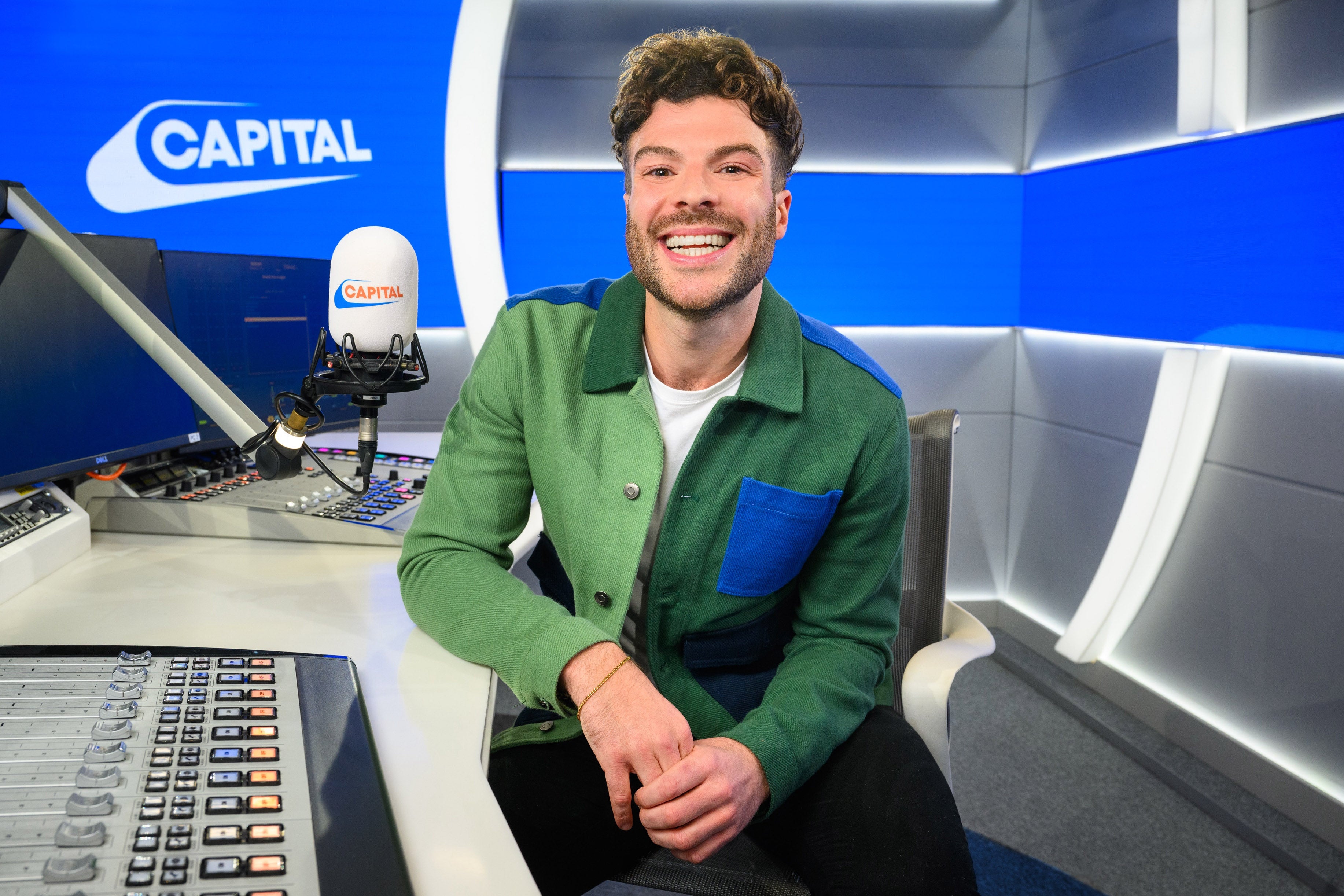 Jordan North pictured at his new desk